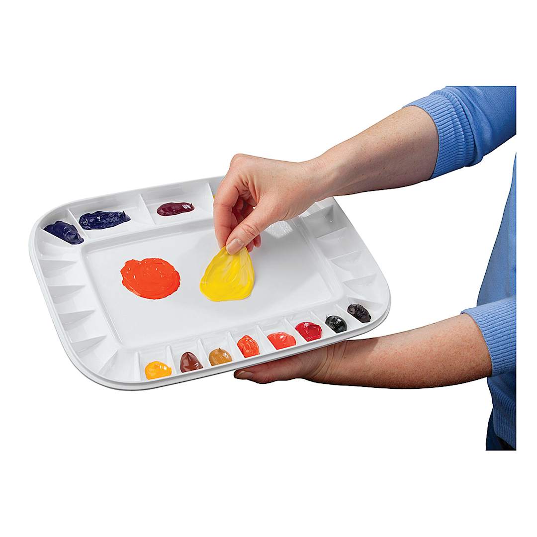 Open in modal - Mijello Artelier Peel-off Palette - Artist's hand peeling paint off used Palette
