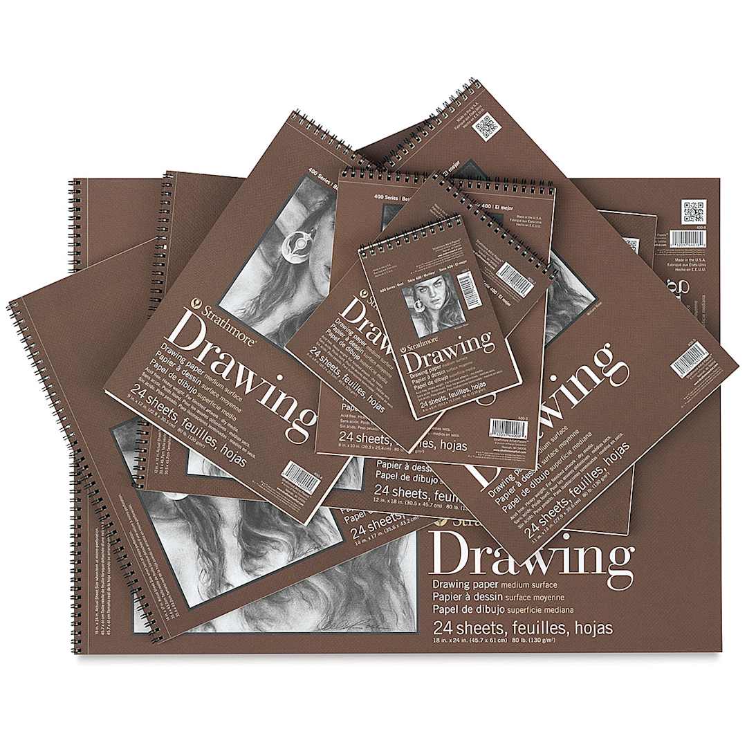 Open in modal - Strathmore 400 Series Drawing Paper Pads - Uneven stack of eight pads, brown covers, assorted sizes.