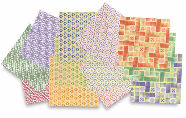 Open in modal - Aitoh Komon Print Chiyogami Paper - Several sheets of package of 48 shown scattered in pile
