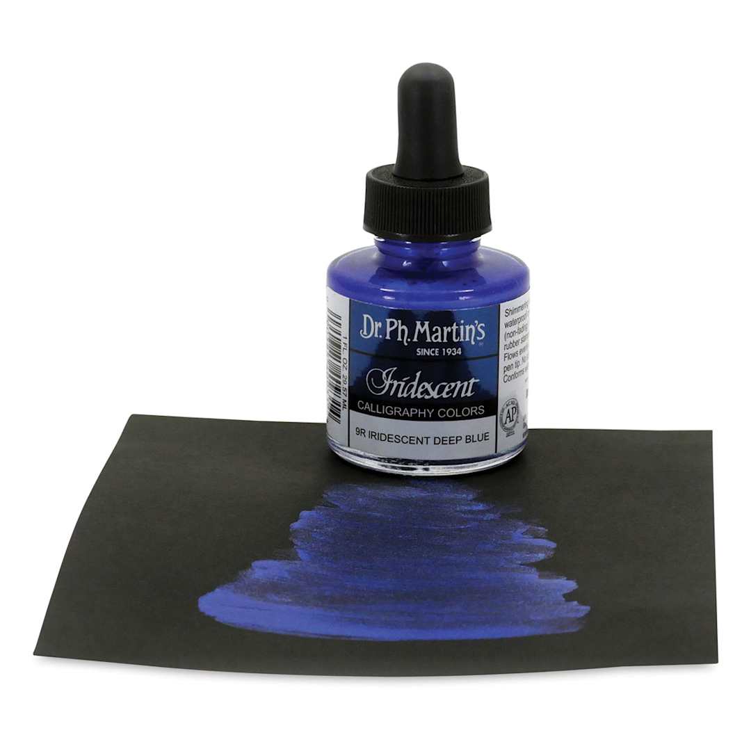 Open in modal - Dr. Ph. Martin's Iridescent Calligraphy Ink - 1 0z Deep Blue bottle on paper with swath of ink