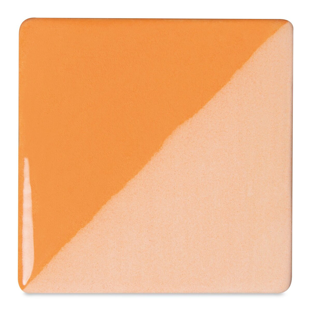 Open in modal - Speedball Ceramic Underglaze - Peach, Opaque, fired on white clay bisque tiles, half covered in Speedball Clear Glaze, fired to cone 05