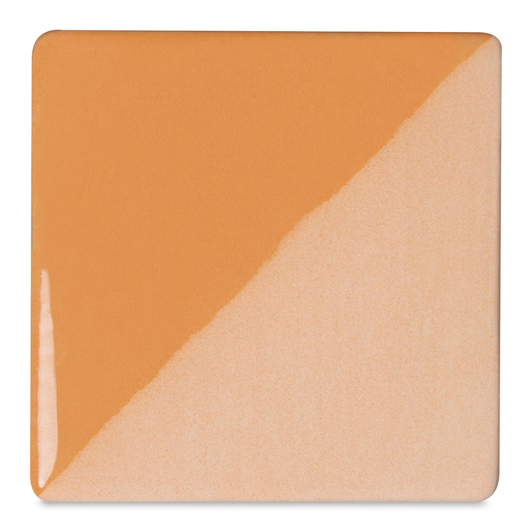 Open in modal - Speedball Ceramic Underglaze - Peach, Opaque, fired on white clay bisque tiles, half covered in Speedball Clear Glaze, fired to cone 05