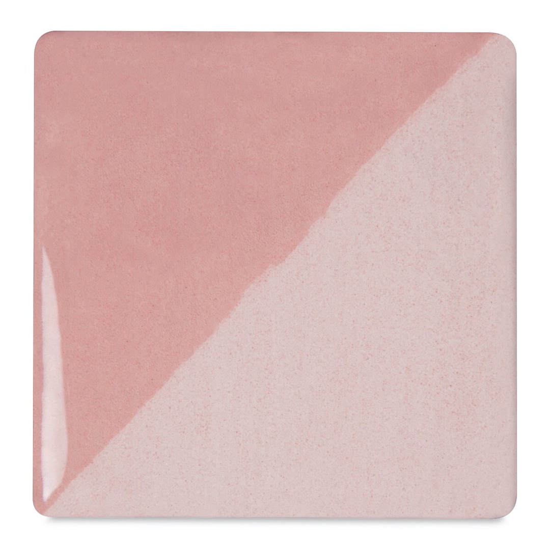 Open in modal - Speedball Ceramic Underglaze - Soft Pink, Opaque, fired on white clay bisque tiles, half covered in Speedball Clear Glaze, fired to cone 05