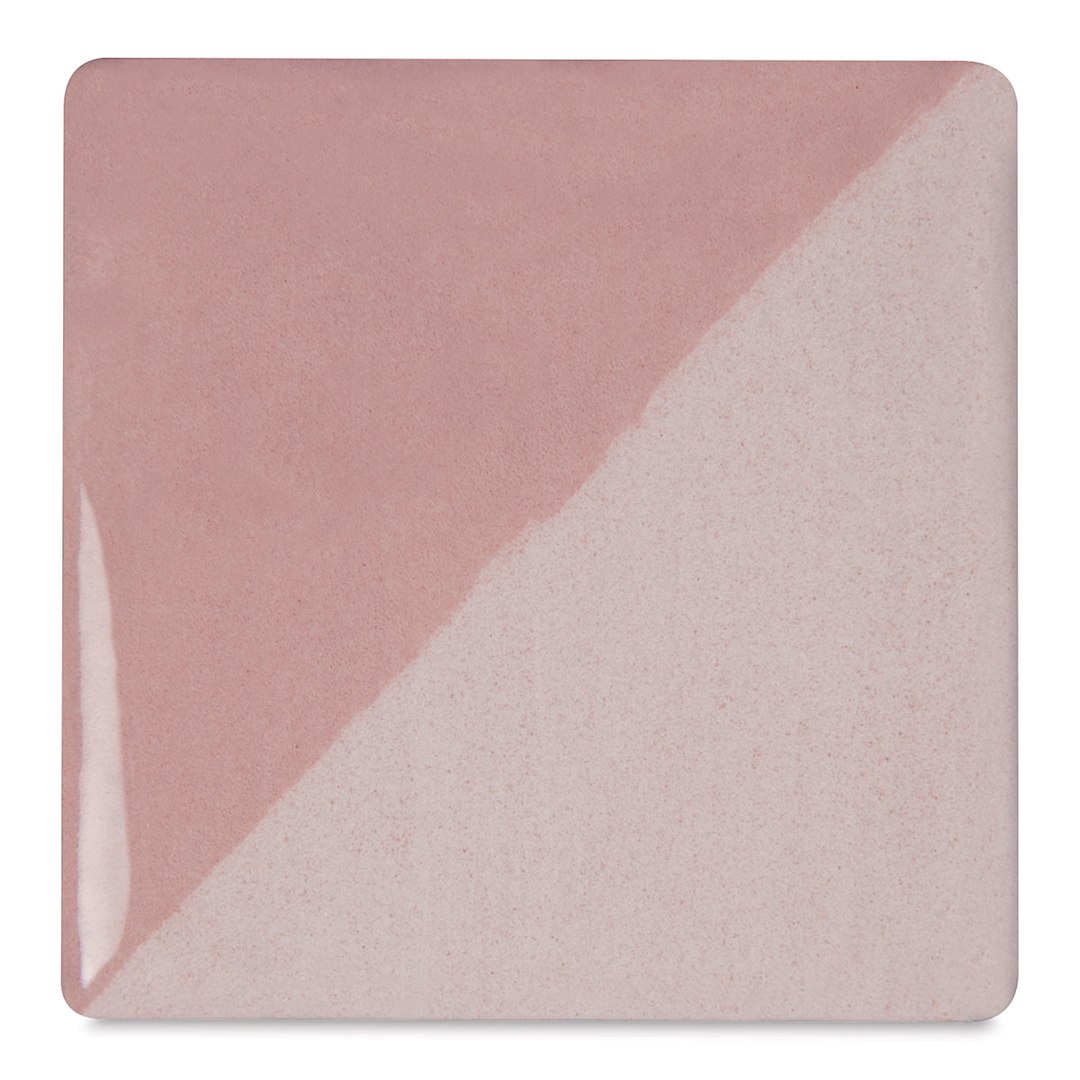 Open in modal - Speedball Ceramic Underglaze - Soft Pink, Opaque, fired on white clay bisque tiles, half covered in Speedball Clear Glaze, fired to cone 05