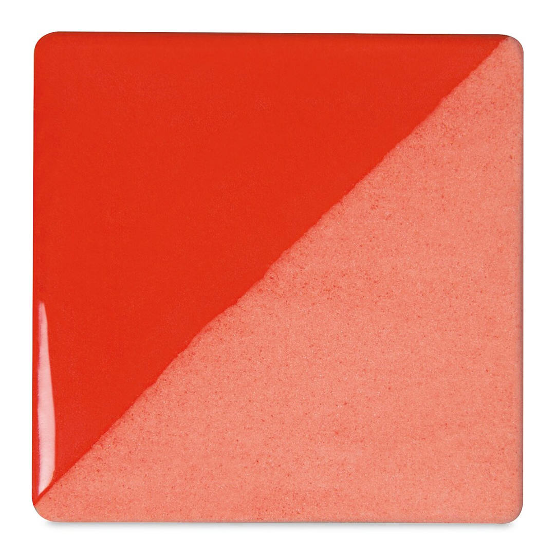 Open in modal - Speedball Ceramic Underglaze - Flame Red, Opaque, fired on white clay bisque tiles, half covered in Speedball Clear Glaze, fired to cone 05