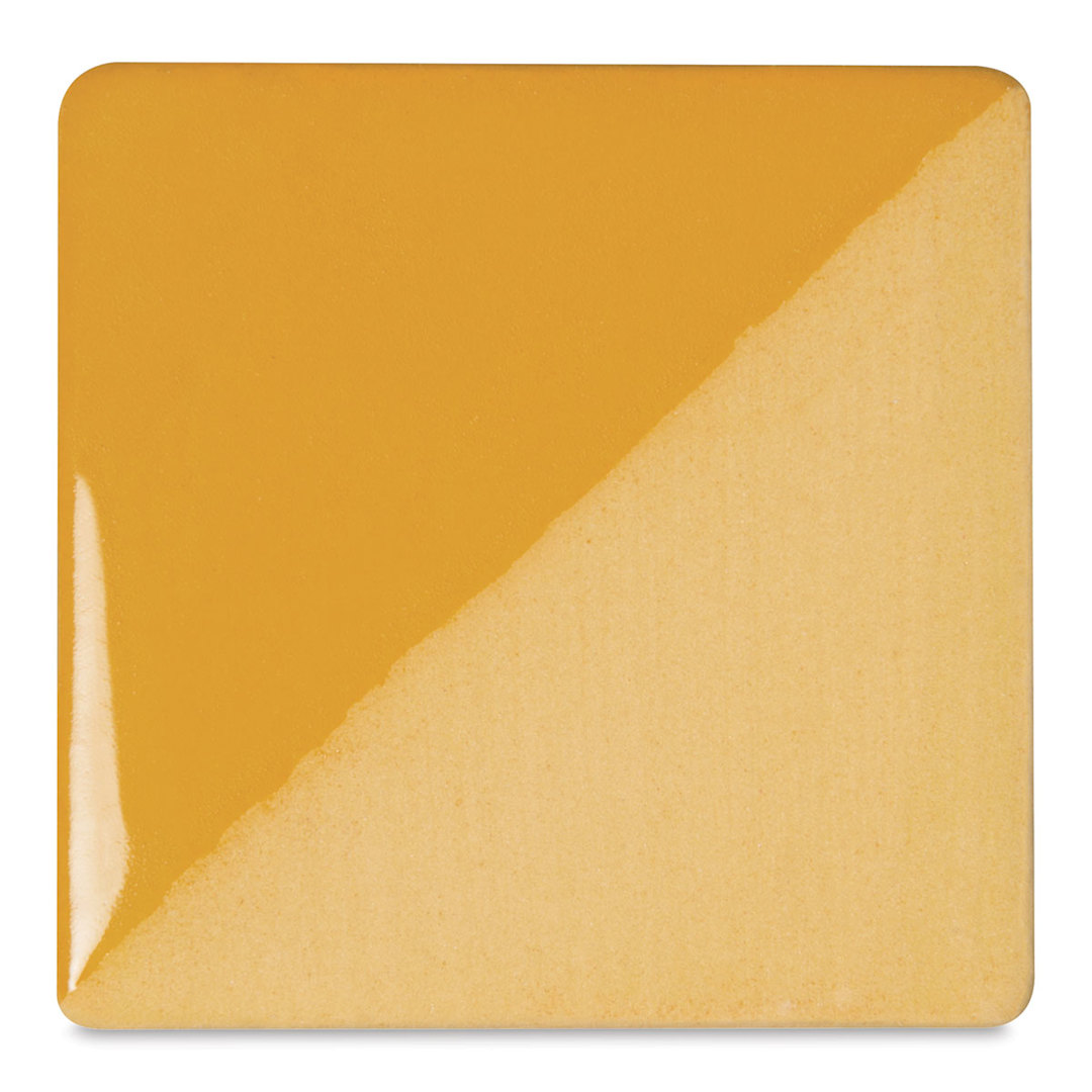 Open in modal - Speedball Ceramic Underglaze - Saffron Yellow, Opaque, fired on white clay bisque tiles, half covered in Speedball Clear Glaze, fired to cone 05
