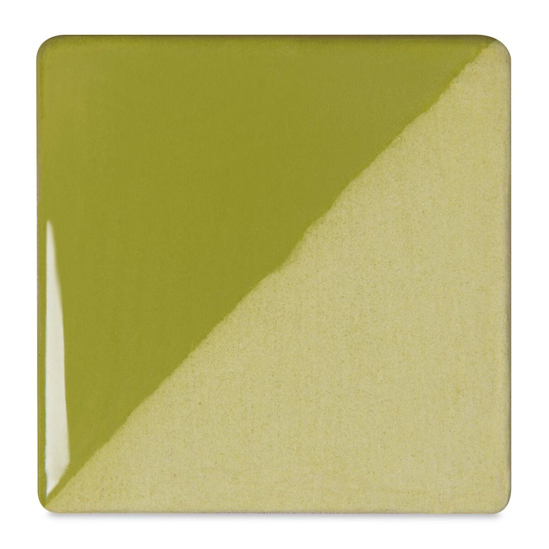Open in modal - Speedball Ceramic Underglaze - Leaf Green, Opaque, fired on white clay bisque tiles, half covered in Speedball Clear Glaze, fired to cone 05