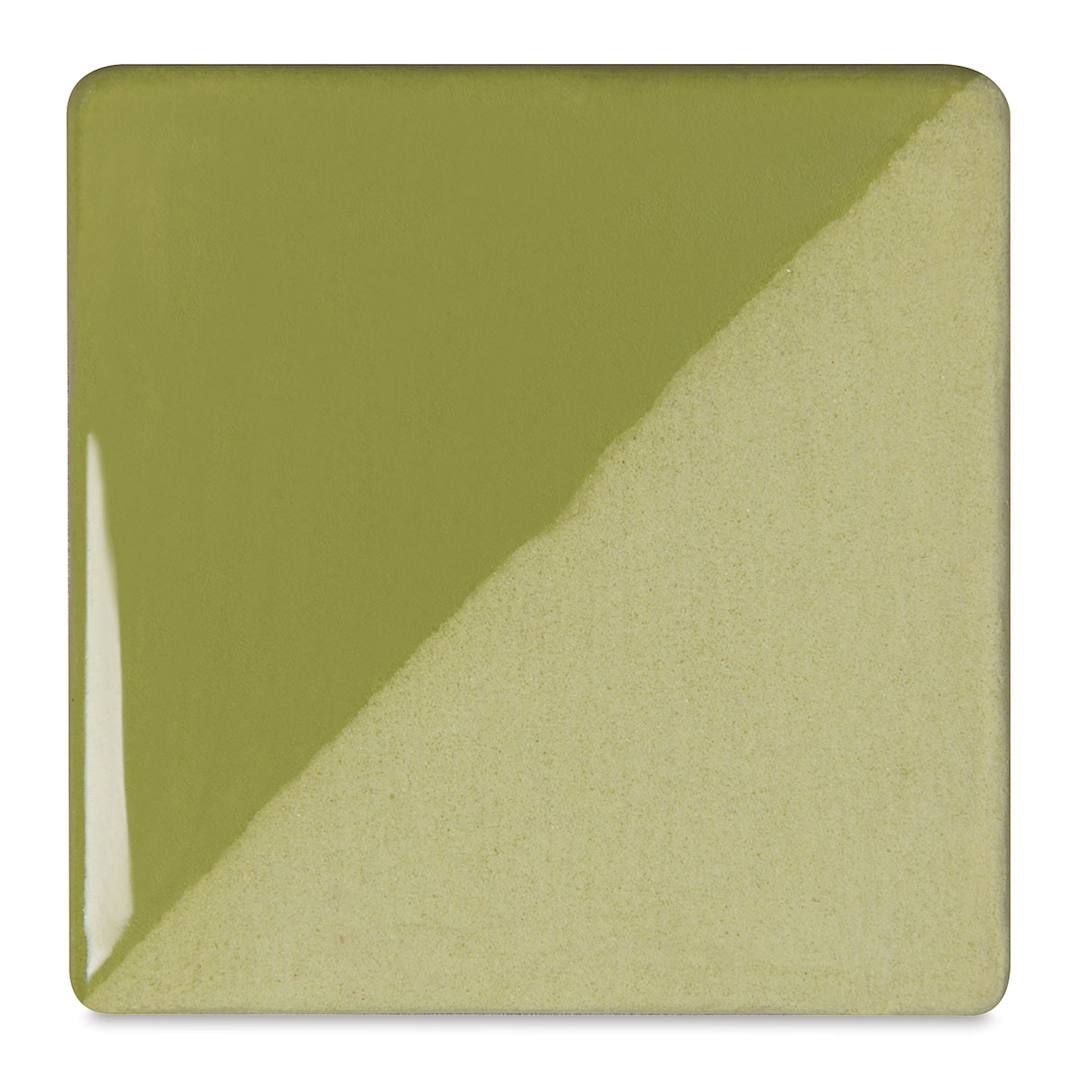 Open in modal - Speedball Ceramic Underglaze - Leaf Green, Opaque, fired on white clay bisque tiles, half covered in Speedball Clear Glaze, fired to cone 05
