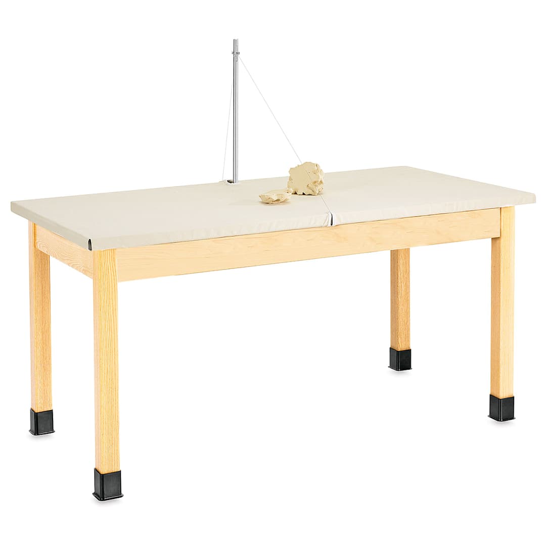 Open in modal - Diversified Spaces Clay Wedging Table - Angled view of table with lump of clay at clay cutter