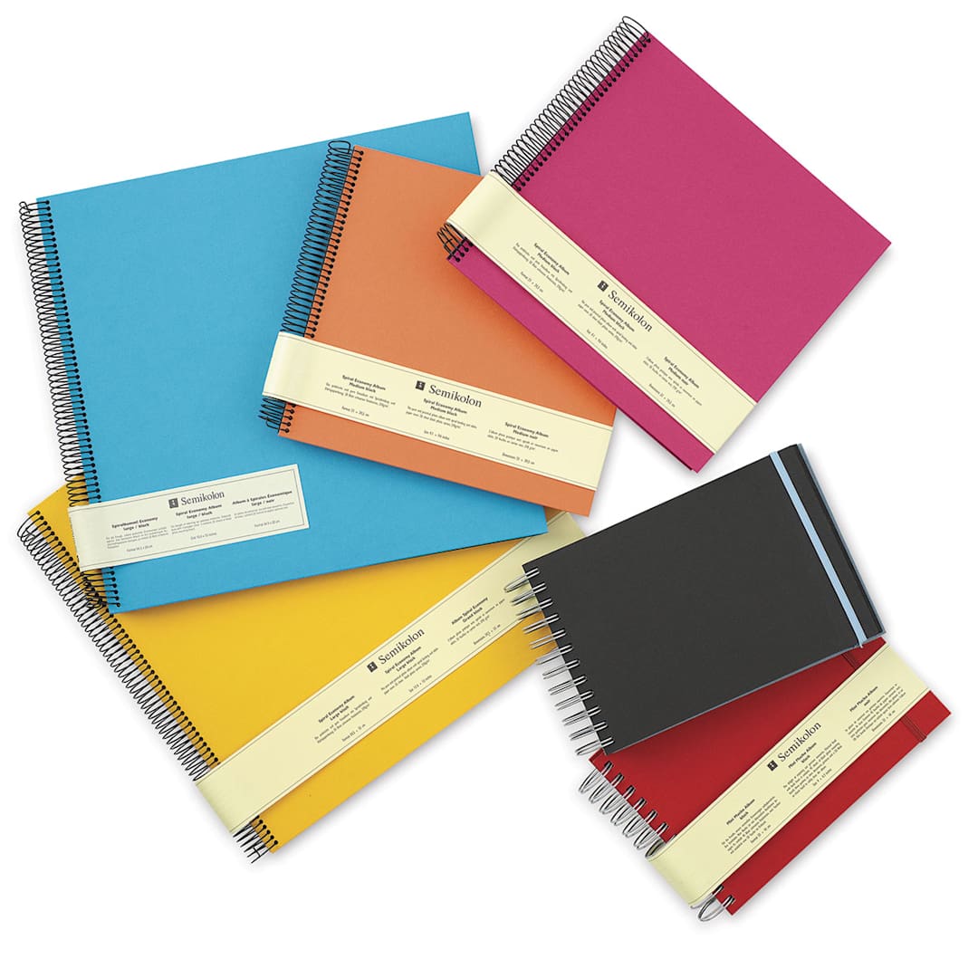 Open in modal - Semikolon Black Page Photo Albums - Several colors and sizes of Albums stacked loosely
