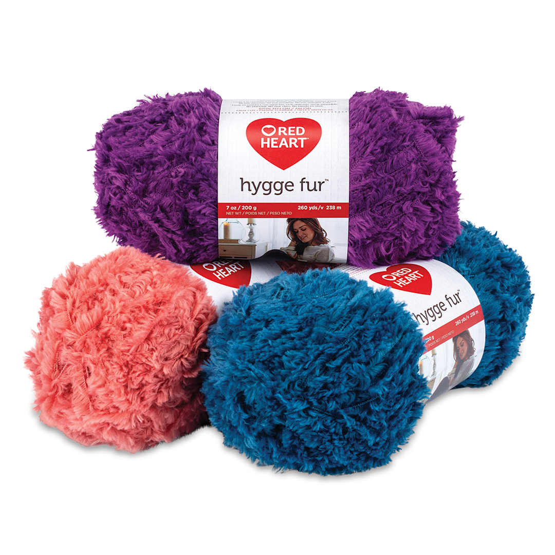 Open in modal - Red Heart Yarn Hygge Fur Yarn - Stack of Three balls of yarn