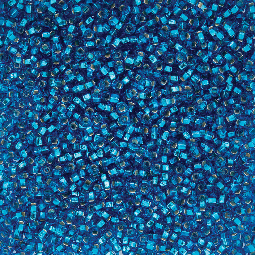 Open in modal - John Bead Czech Glass Seed Beads - Silver-Lined Light Blue, 10/0, 22 g Vial close up