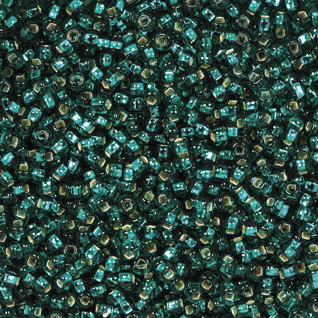 Open in modal - John Bead Czech Glass Seed Beads - Teal Green, Silver Lined, 10/0, 22 g Vial close up
