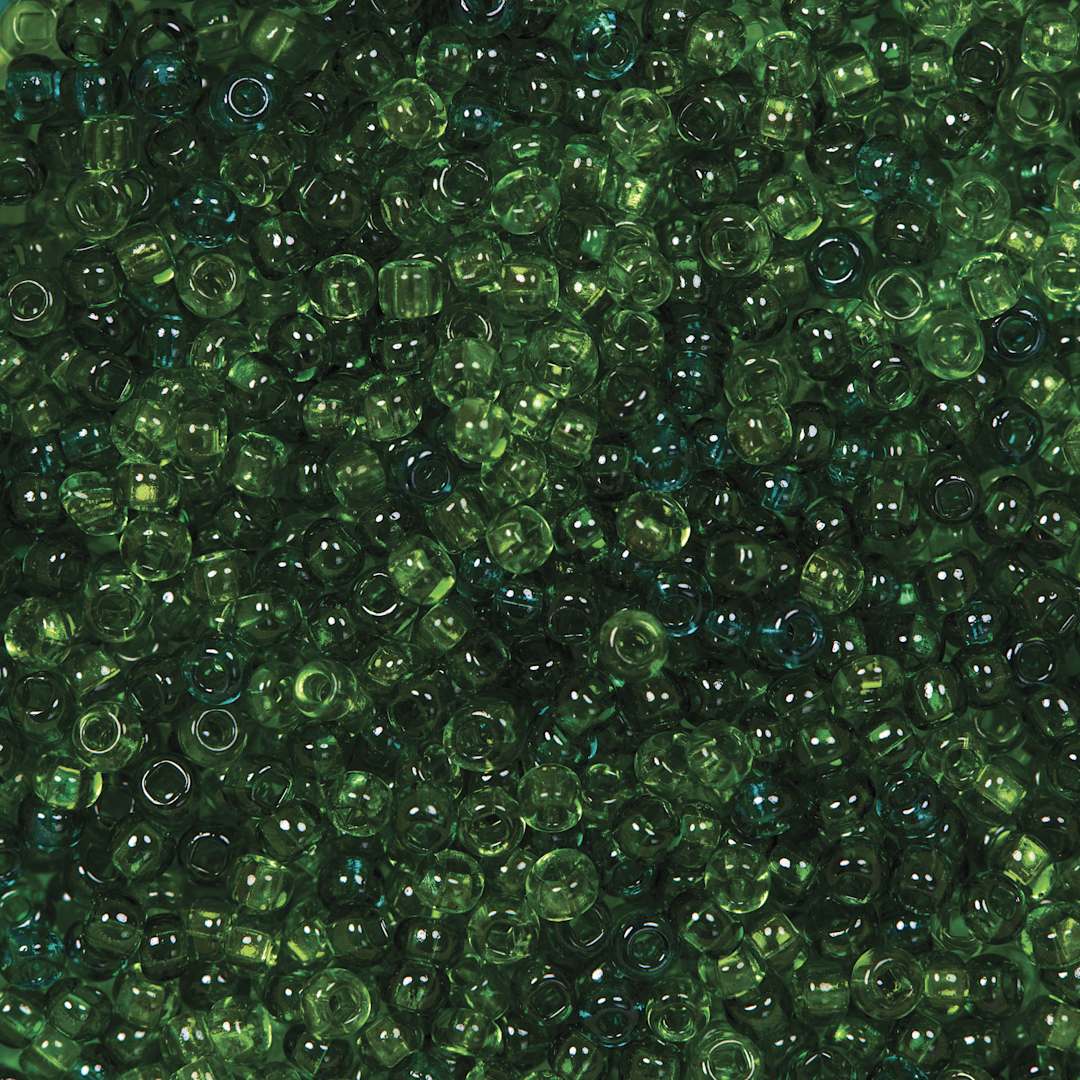 Open in modal - John Bead Czech Glass Seed Beads - Transparent Sea Green, Luster Mix, 10/0, 22 g Vial close up