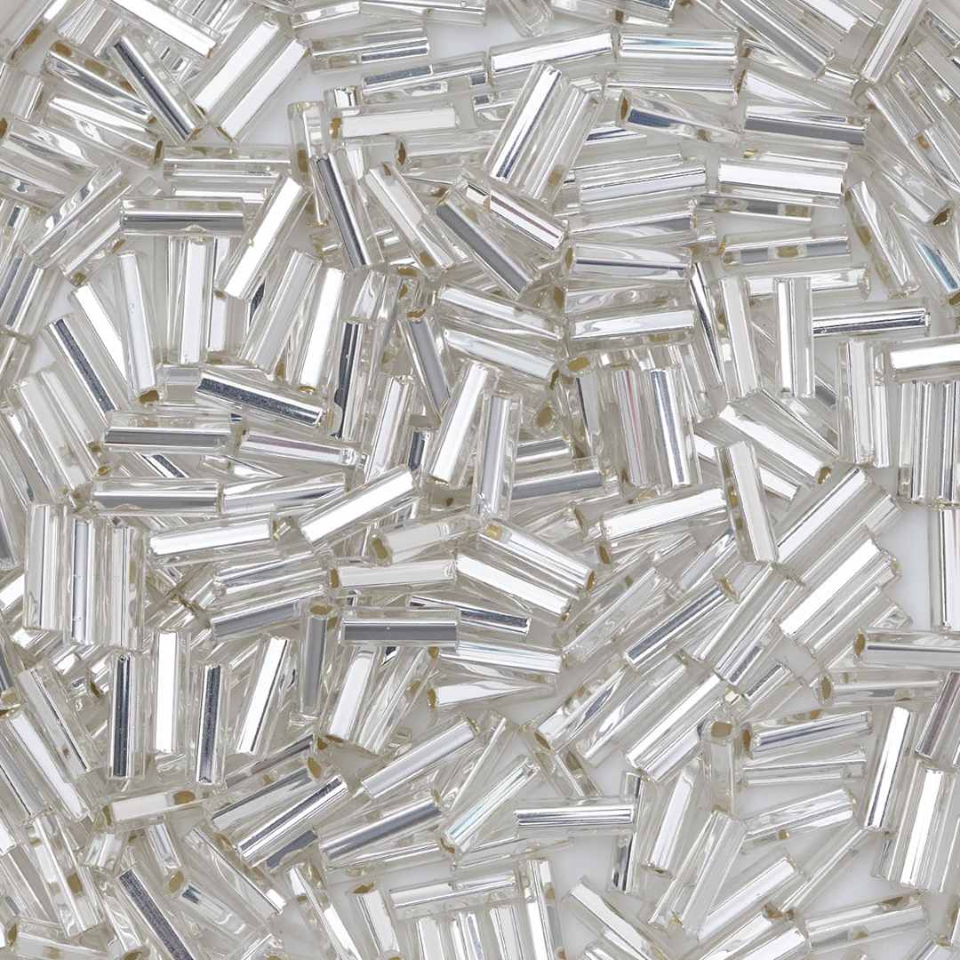 Open in modal - John Bead Czech Glass Seed Beads - Bugle Style, Crystal, 10/0, 22 g Vial close up