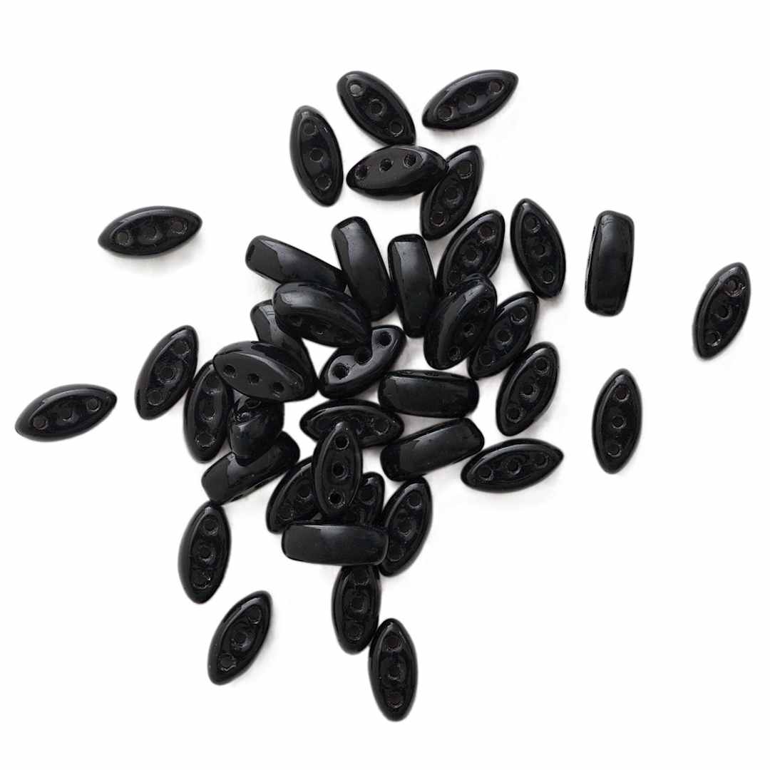 Open in modal - John Bead Czech Glass Cali Three-Hole Beads - Black beads in loose pile
