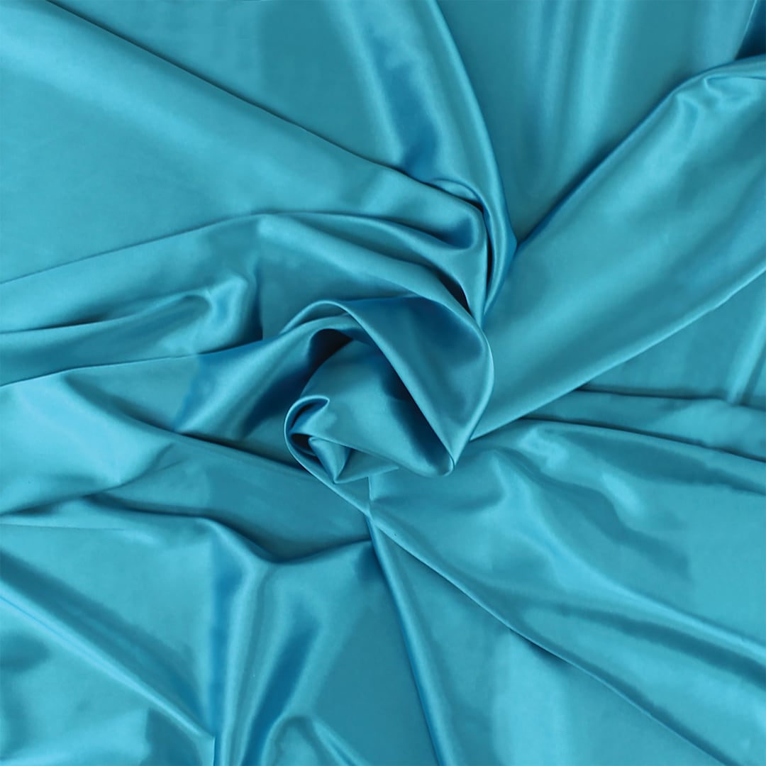 Open in modal - Camelot Stretch Charmeuse - Turquoise, 59" x 15 yds, rolled up