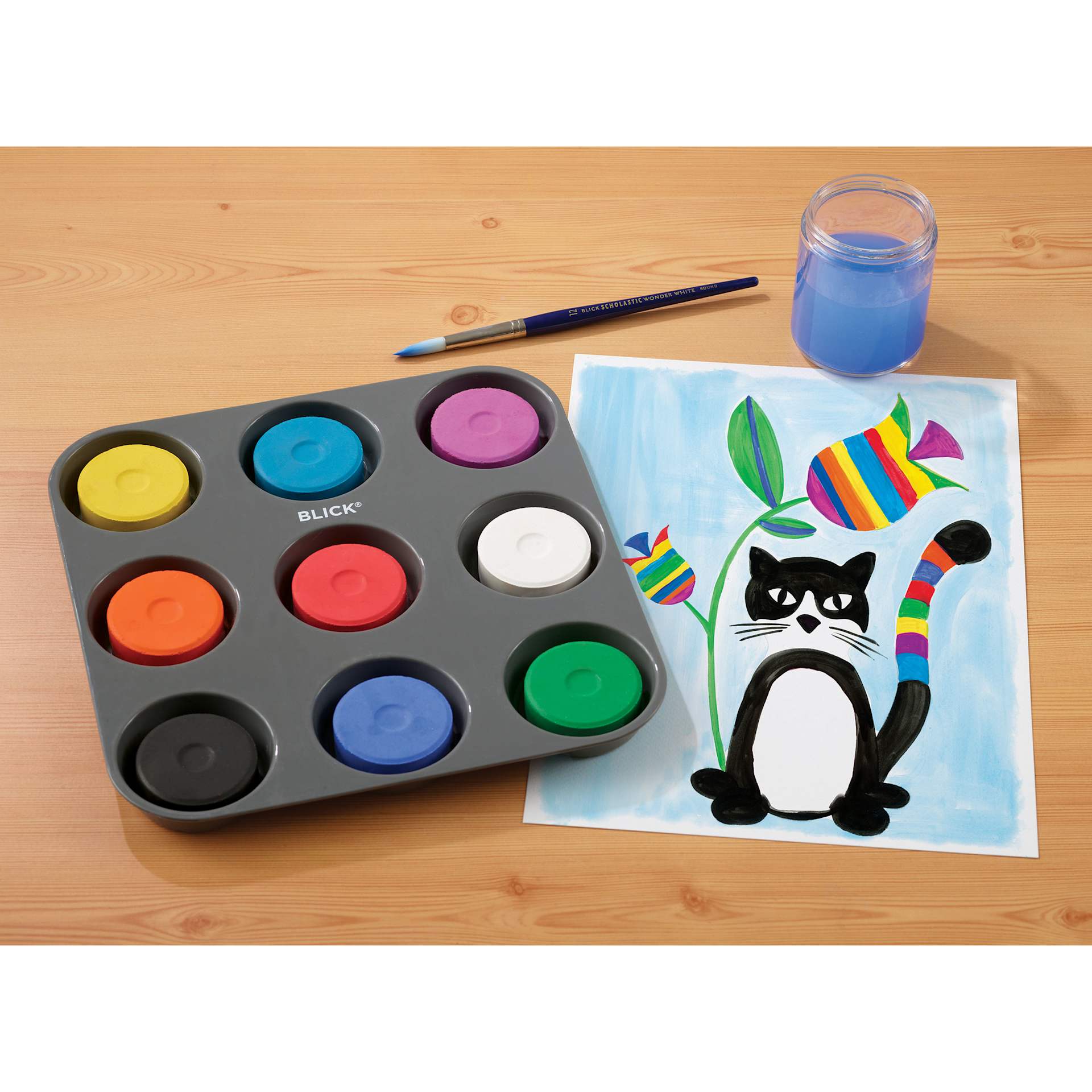 Blick Essentials Tempera Cakes Set of 9 Assorted Colors ina Tray, with a brush, cup of water, and a painting of a cat.
