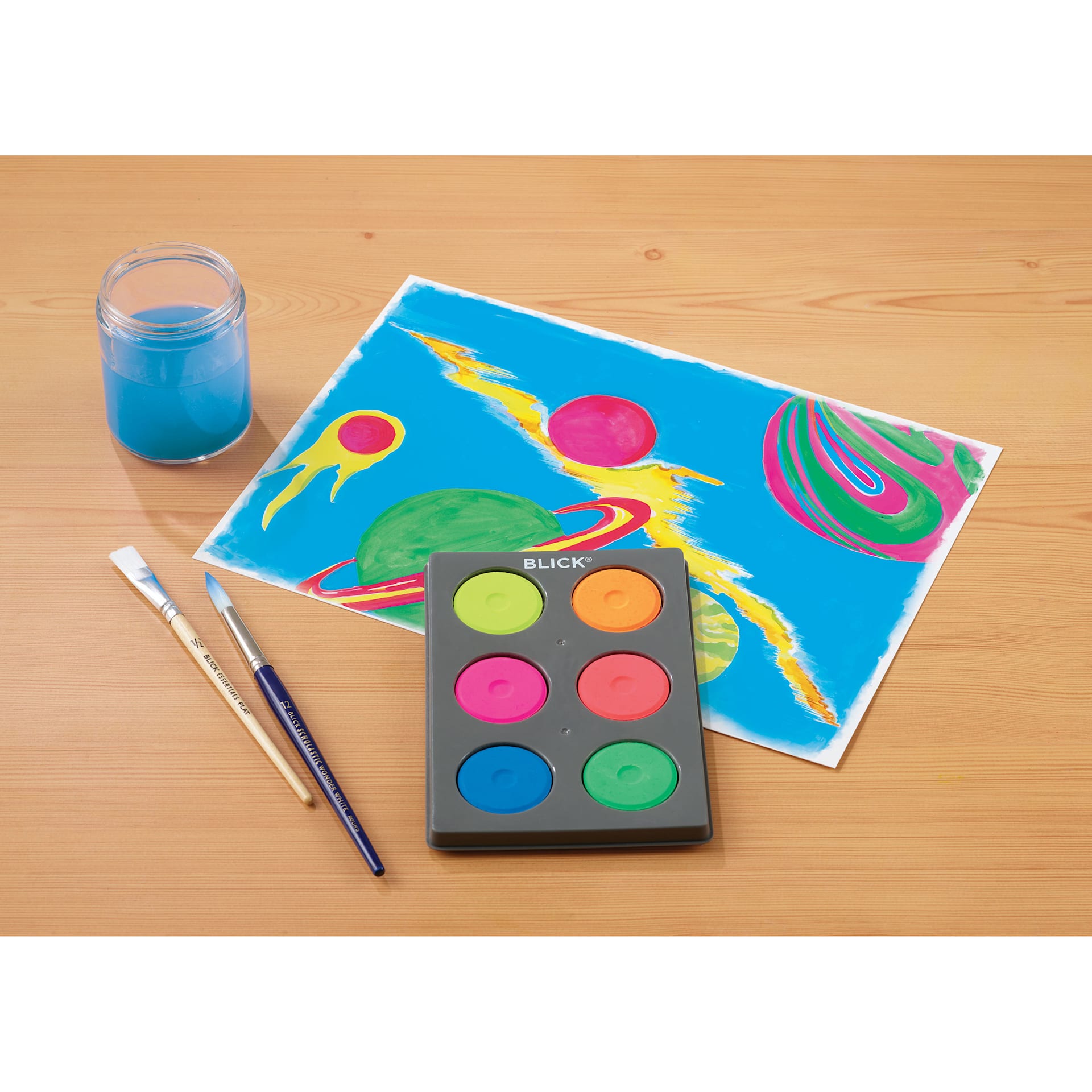 Blick Essentials Tempera Cakes Set of 6 Fluorescent Colors with a Tray, brushes, cup of water, and an abstract painting.