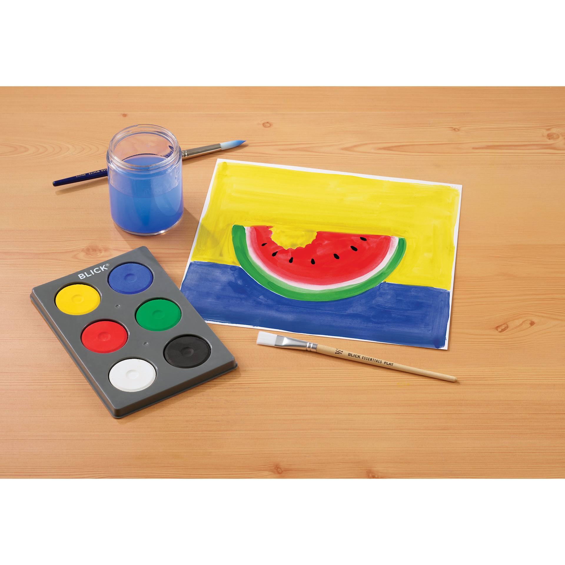 Blick Essentials Tempera Cakes Set of 6 Primary Colors a with Tray next to a painting of a watermelon.