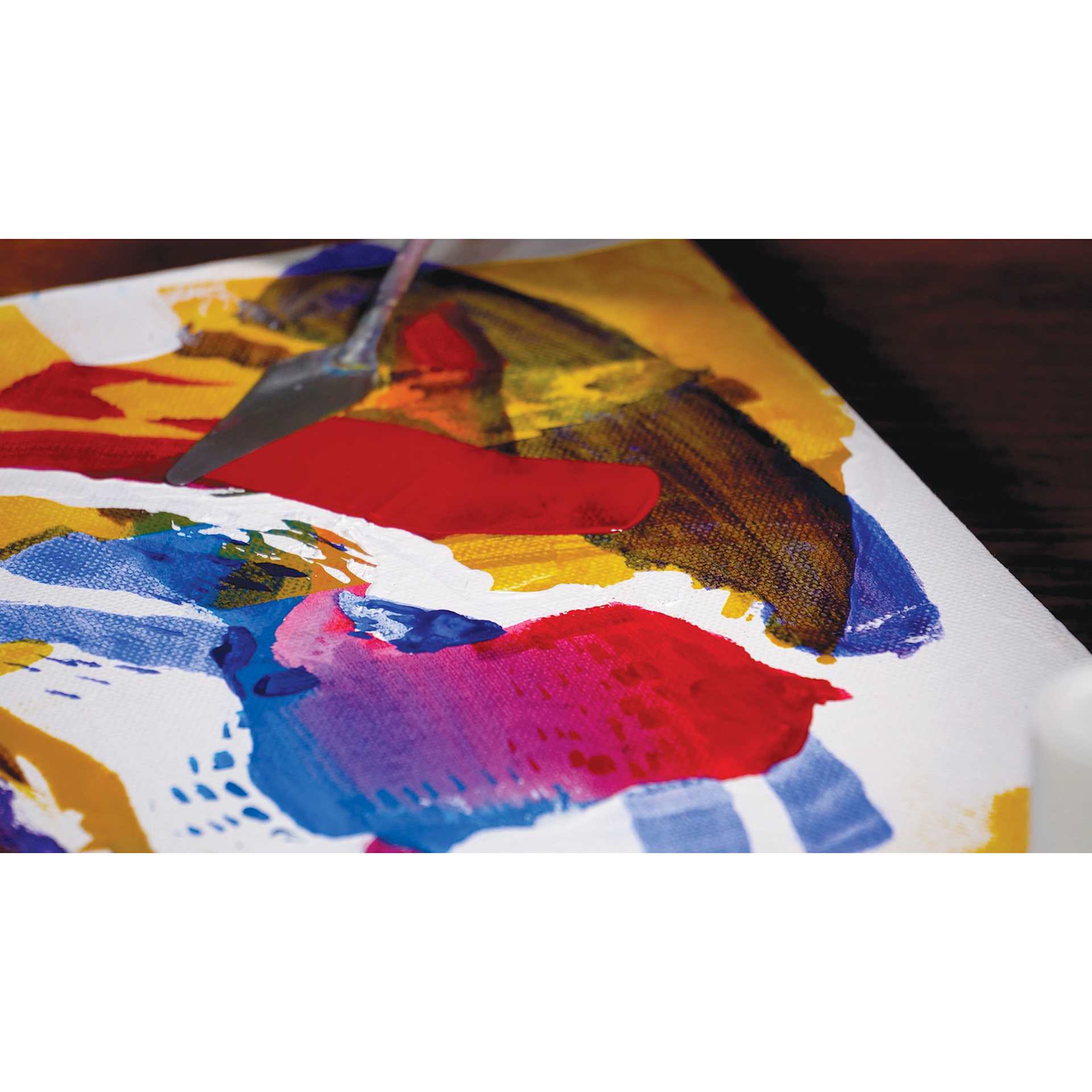 Liquitex Professional Soft Body Acrylic Paints and Sets, painting knife applying red paint on canvas
