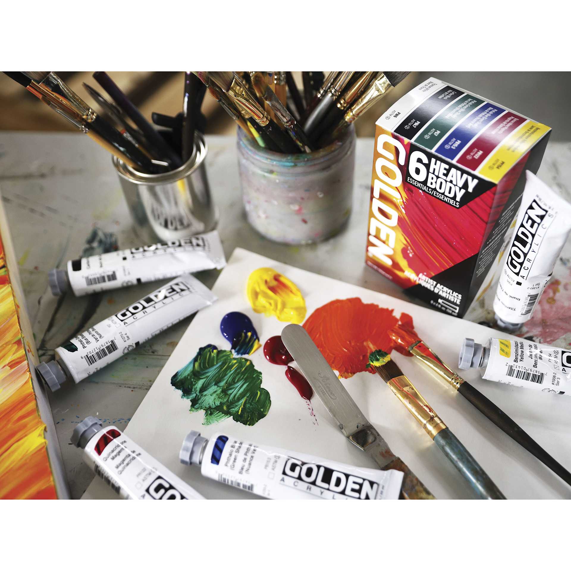 Golden Heavy Body Artist Acrylic Set - Essentials Set of 6, Assorted Colors, 59 ml Tubes, on desk