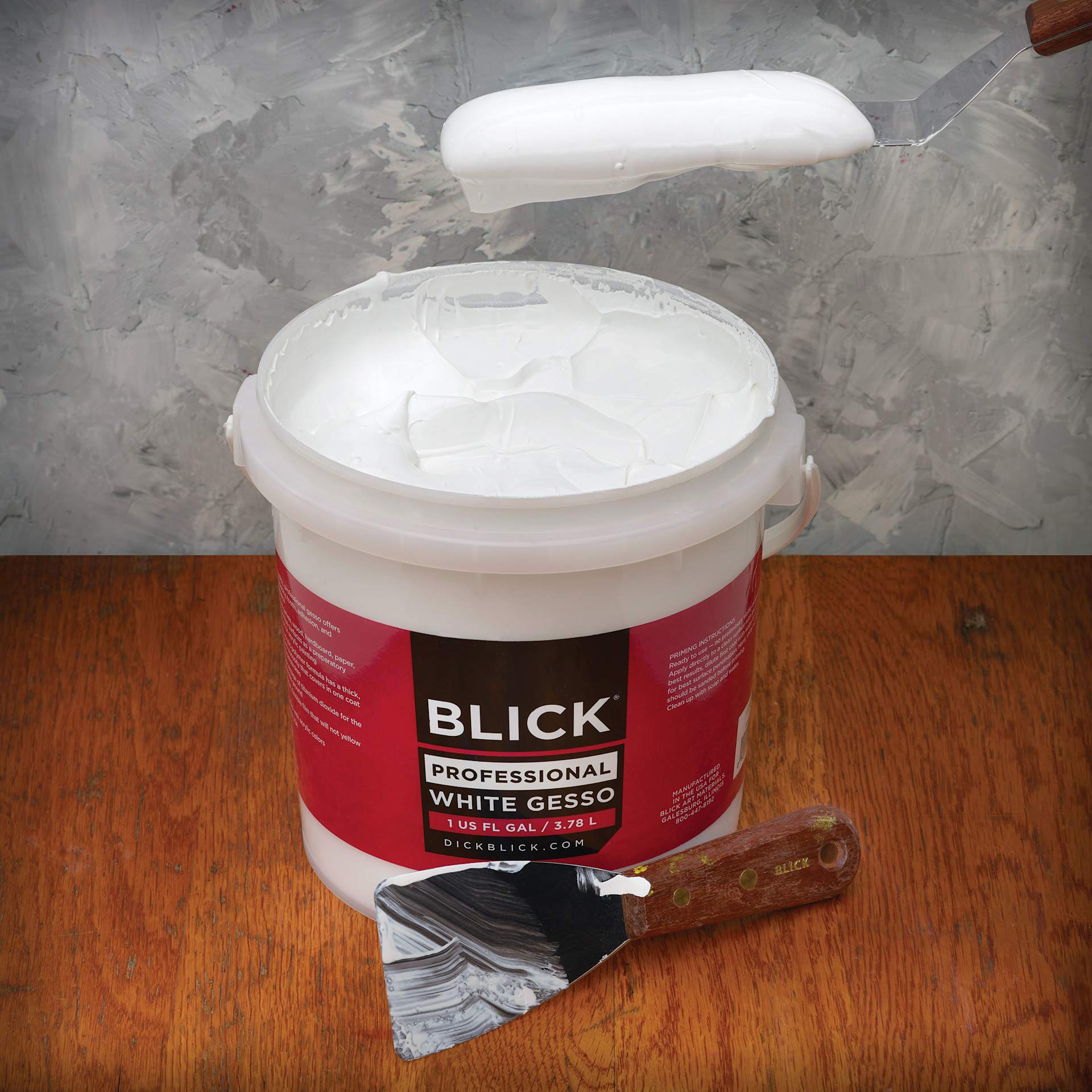 Blick Artists Acrylic Gesso - Professional White, Gallon tub showing viscosity