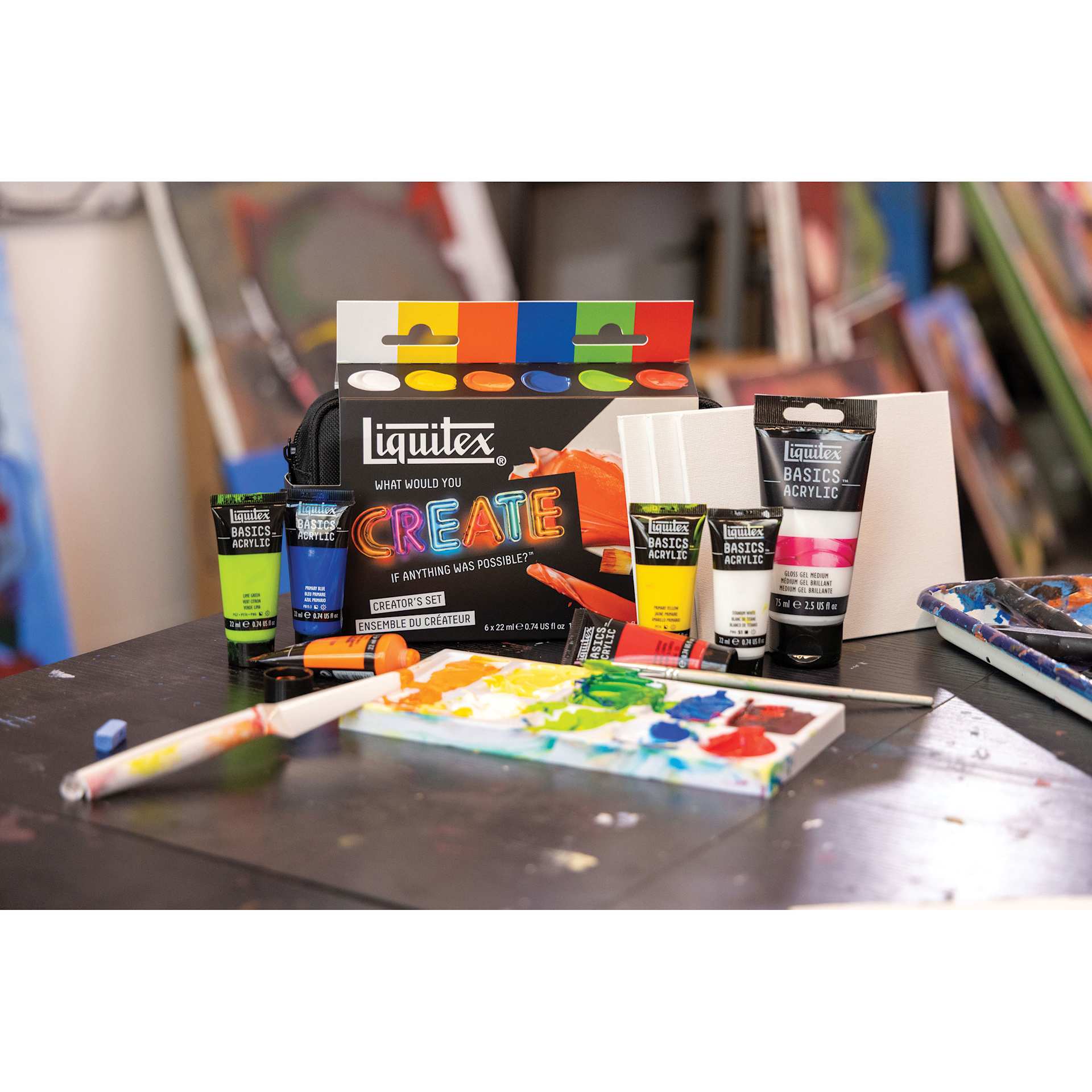 Liquitex What Would You Create Basics Acrylic Set - Creator's Set contents spread out on table 