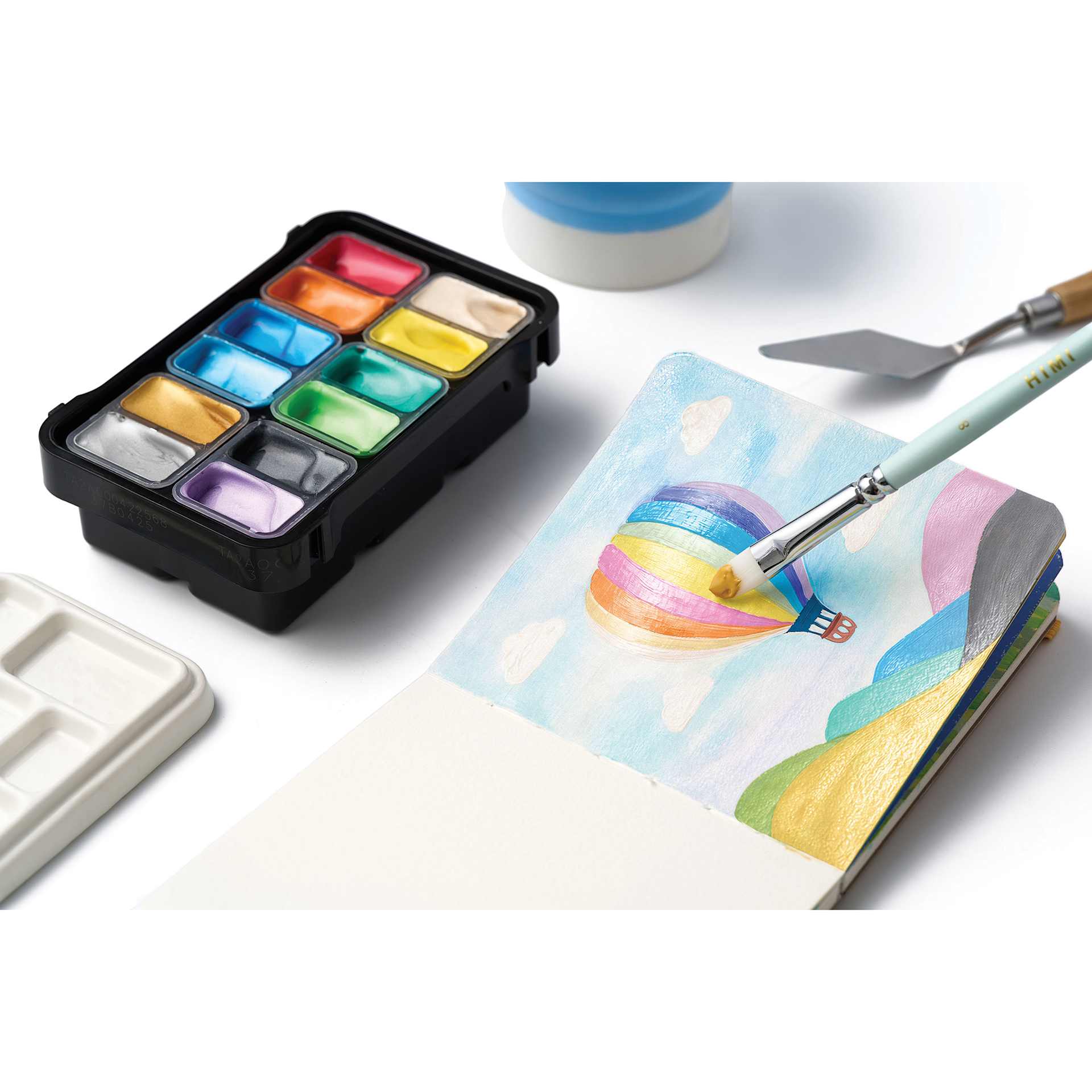 Himi Jelly Gouache Paint - Set of 12, Shiny Metallic, 12 ml cups being used to paint a hot air balloon