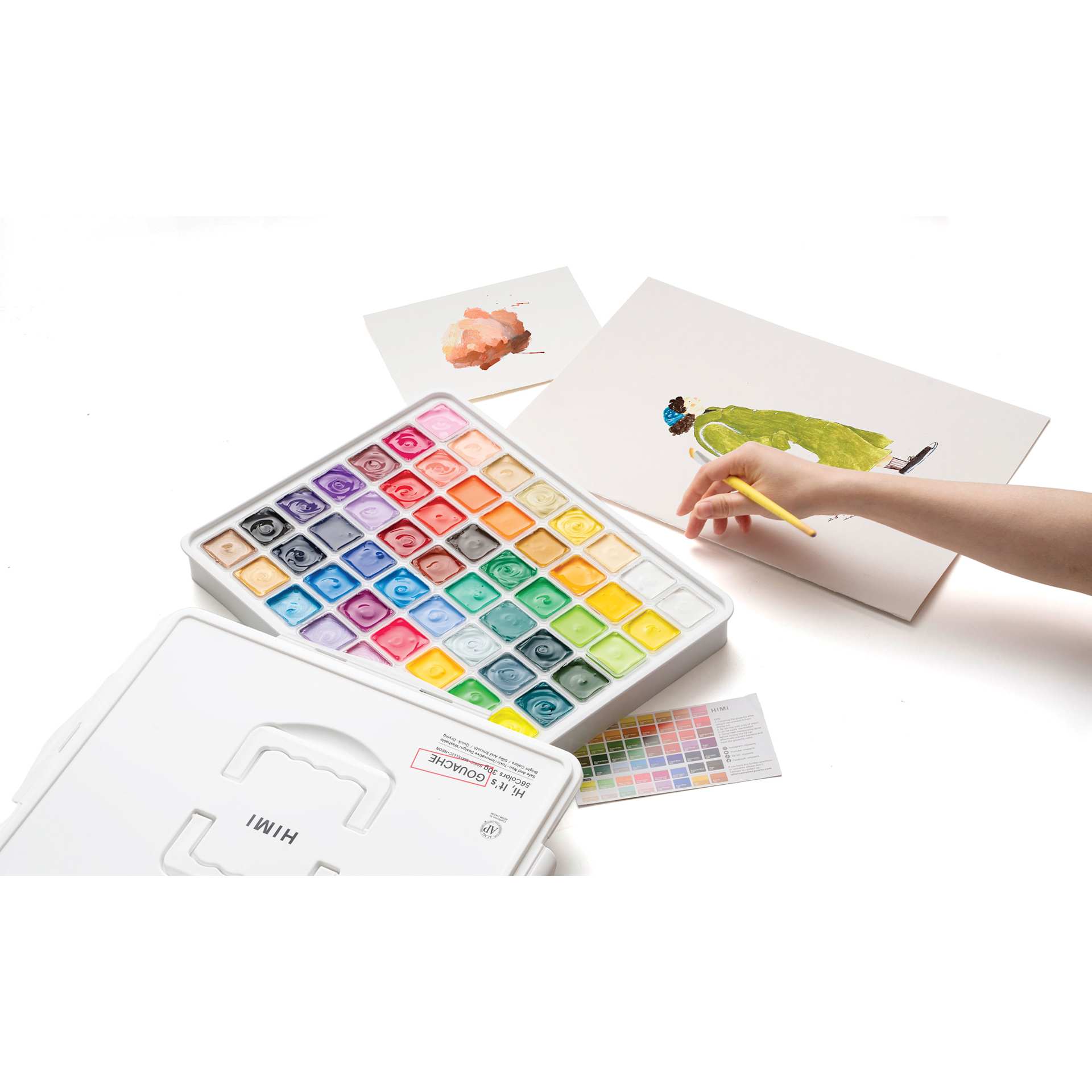 Himi Jelly Gouache Paint Set of 56 being used by a person.