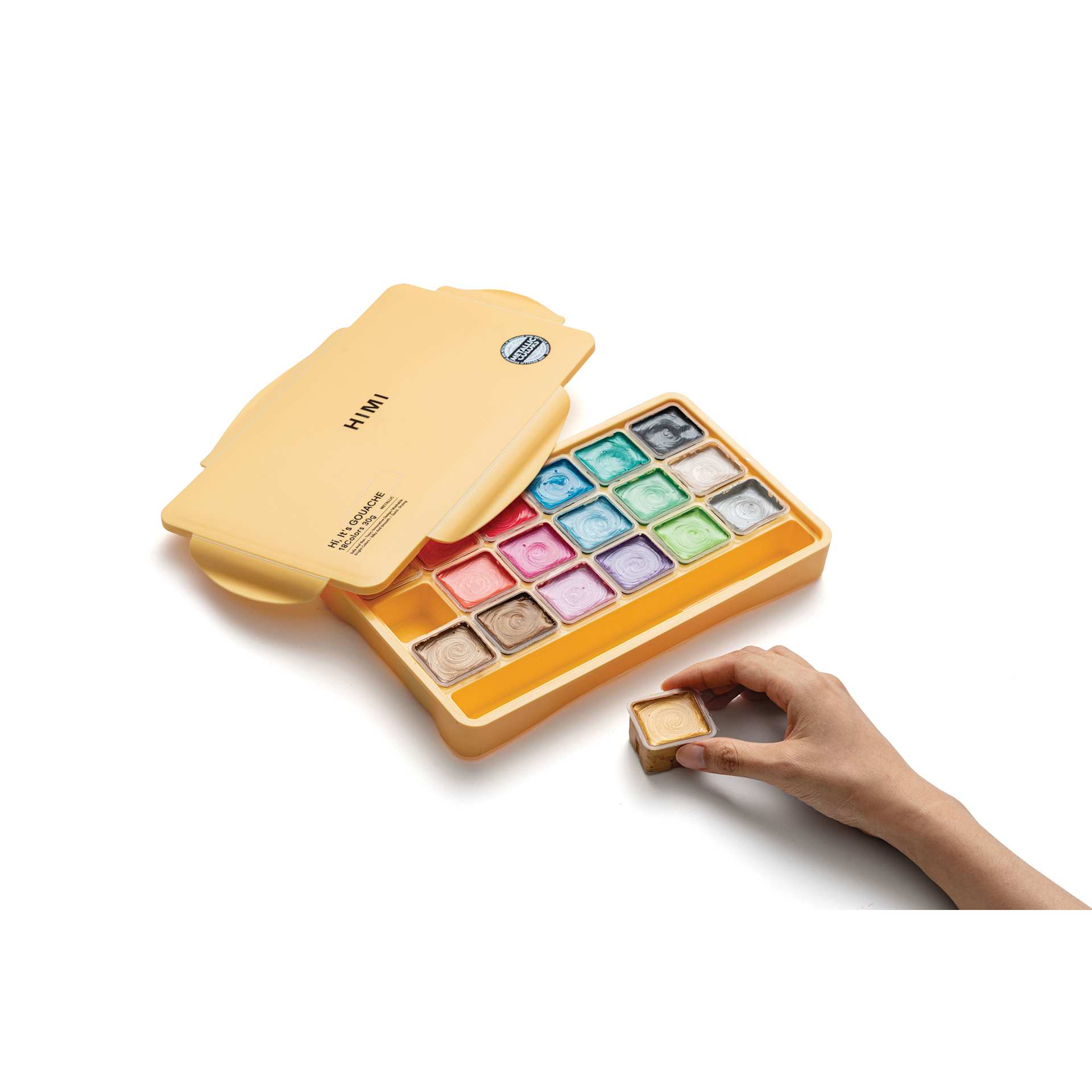 A person using the Himi Jelly Gouache Paints Set of 18, Metallic Colors