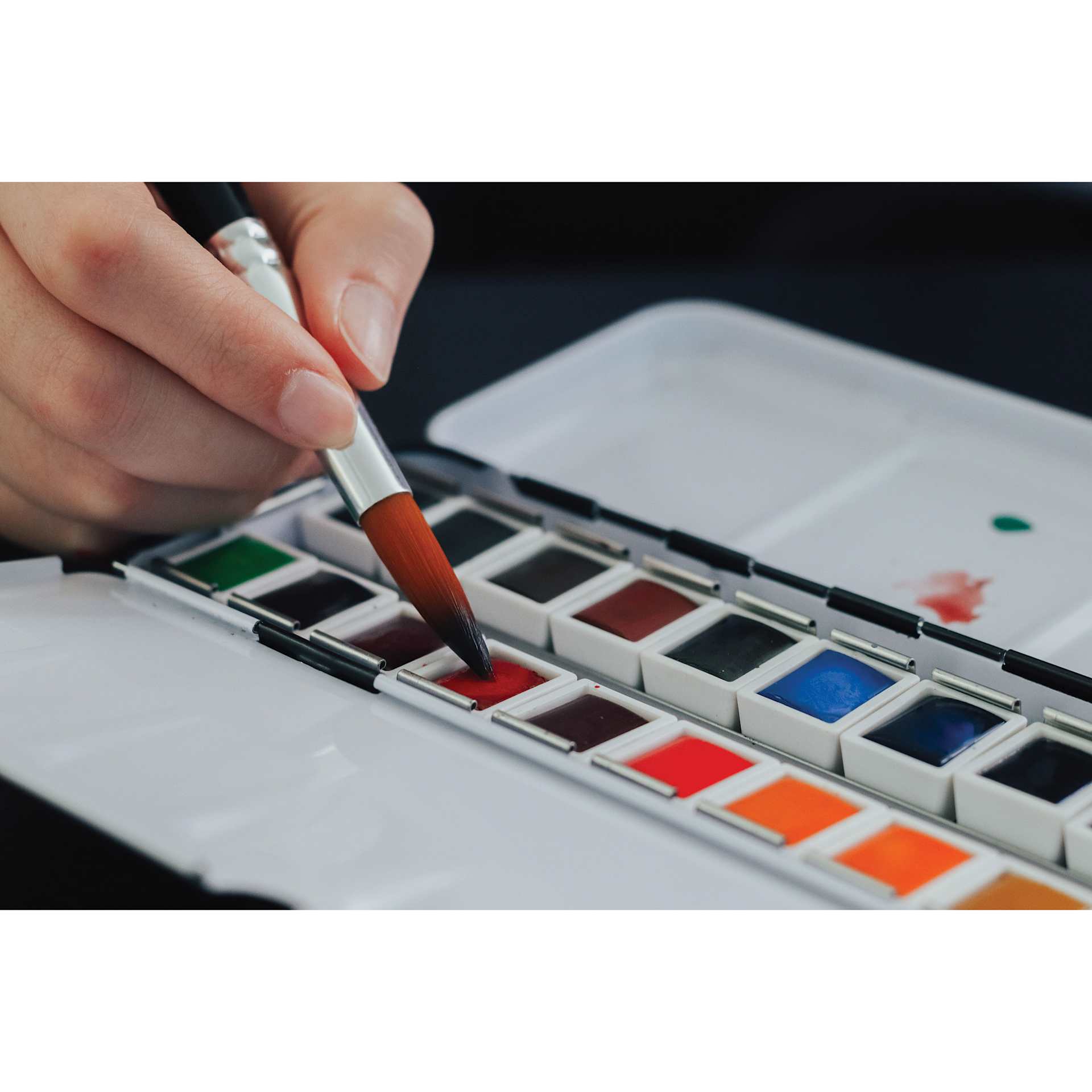 Etchr Half Pan Watercolors - Set of 24, Classic Colors, applying paint to brush