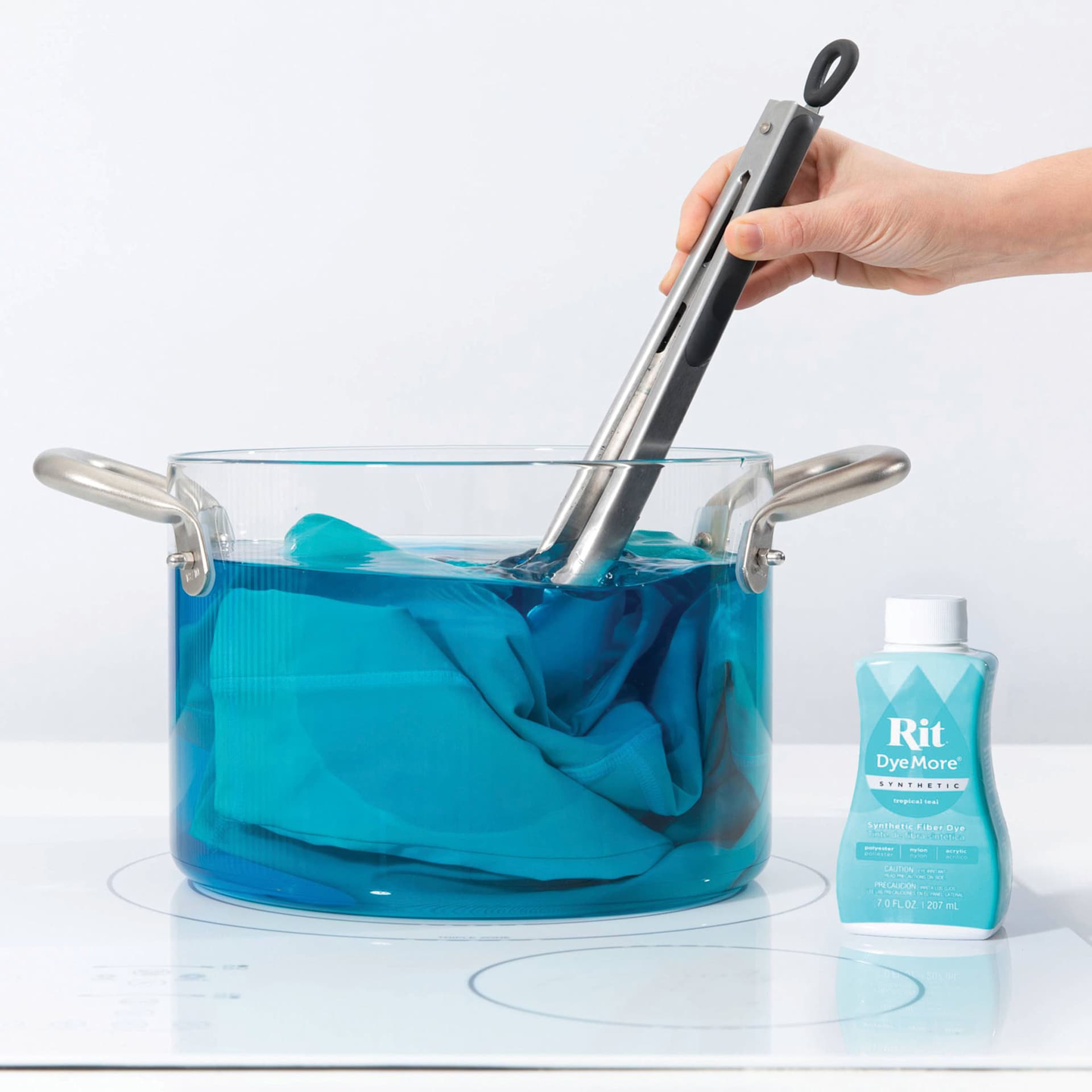 Rit DyeMore Synthetic Fiber Dye -  Tropic Teal, 7 oz, submerging fabric in dyed water