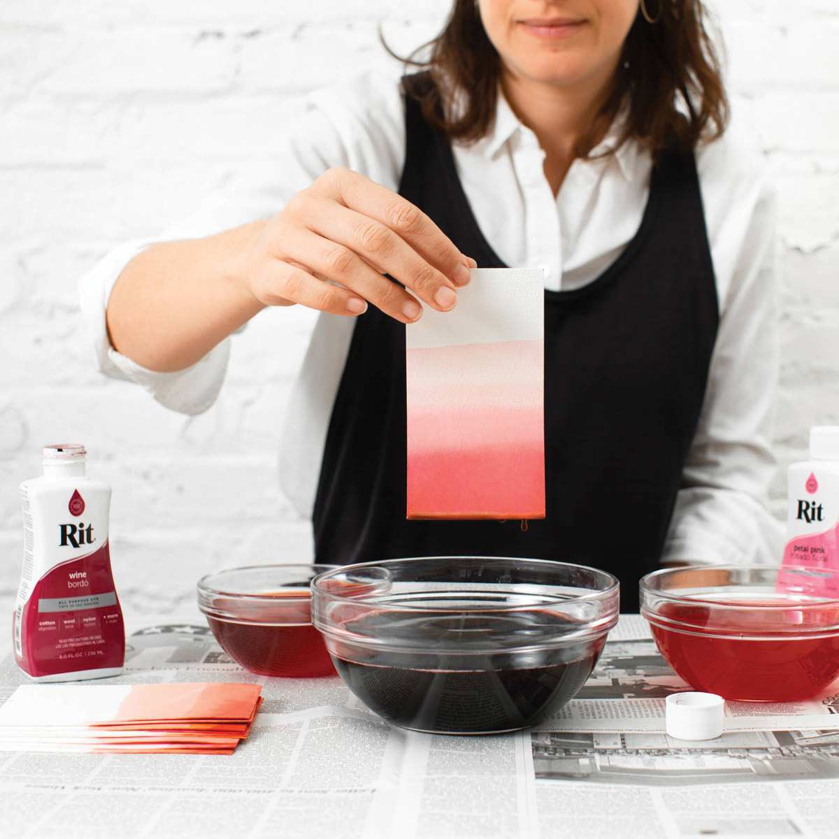 Rit All Purpose Liquid Dye - Wine, 8 oz, dipping paper in dyed water