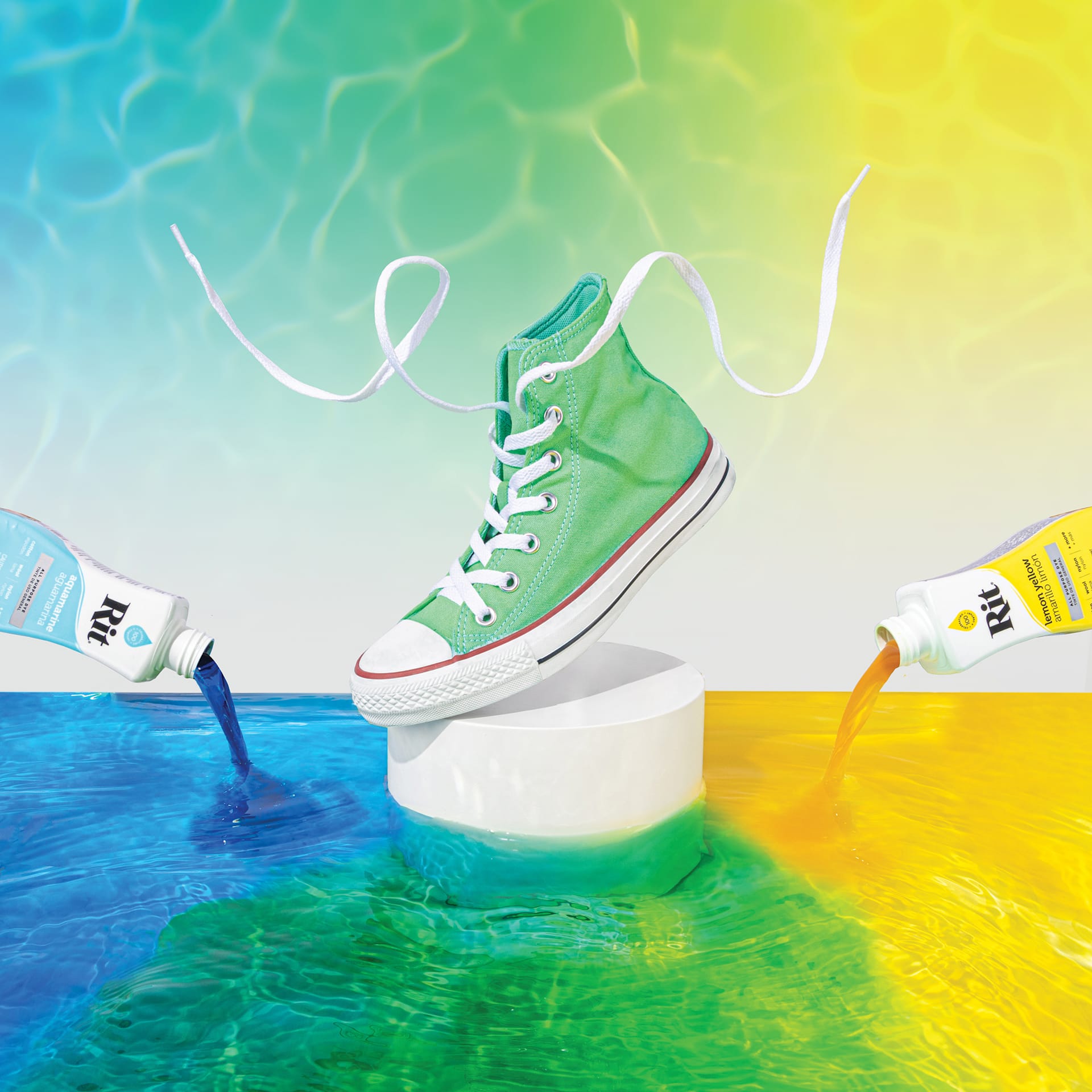 Rit All Purpose Liquid Dye - Converse high-top dyed green on pedestal between aquamarine and lemon yellow