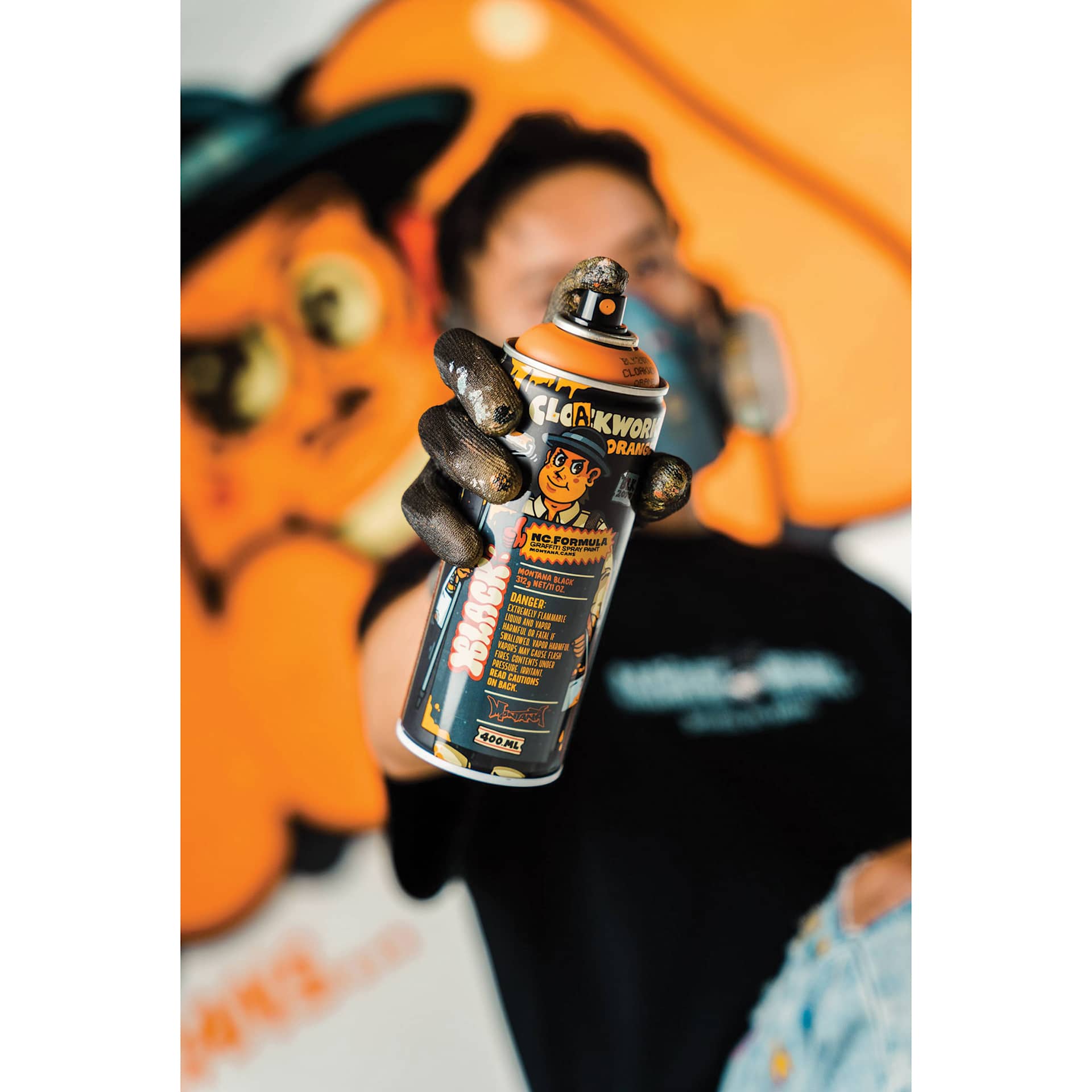 Montana Black Artist Series Spray Paint, Cloakwork (Artist pointing spray paint at camera)