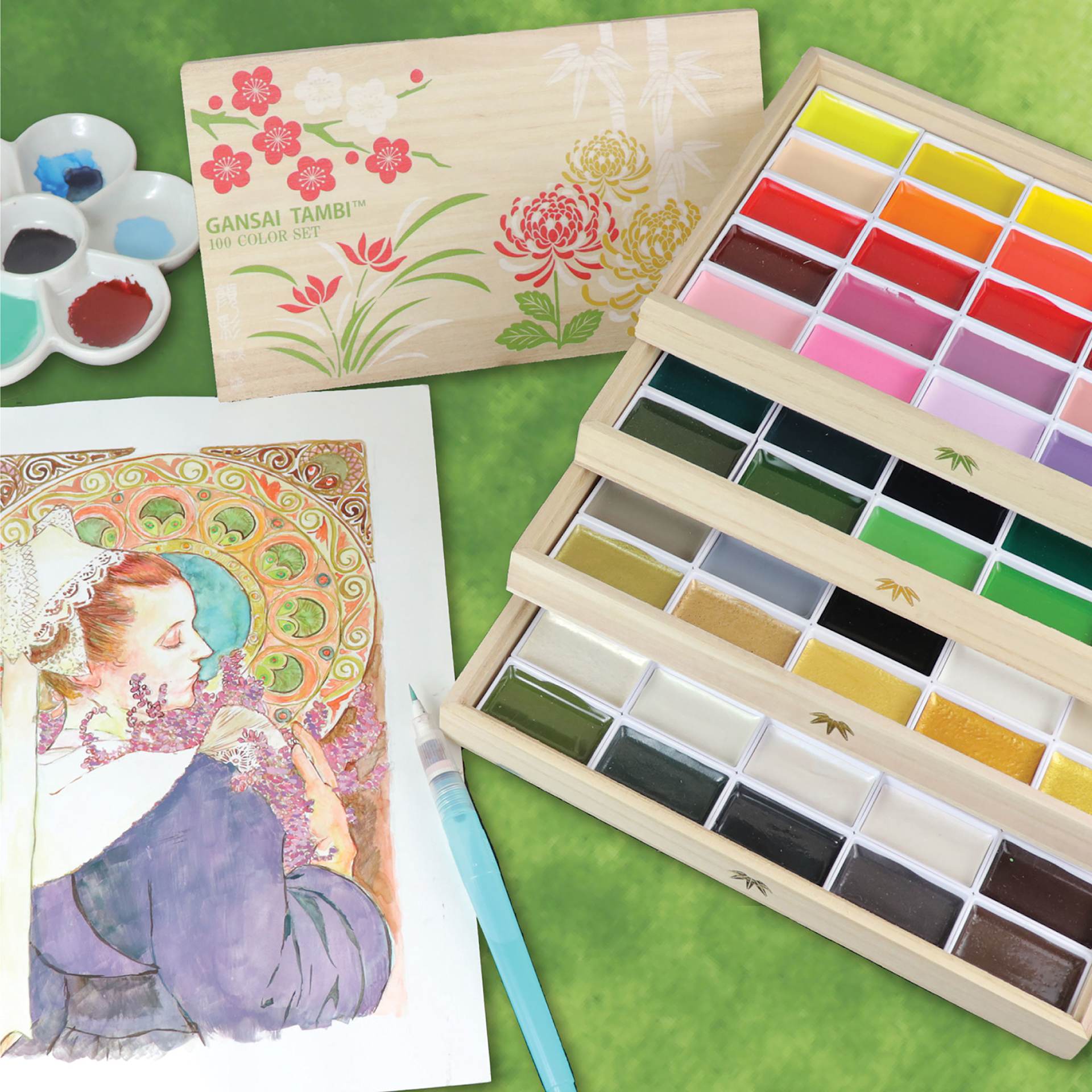 Kuretake Gansai Tambi Watercolor Set of 100 shown with brush and painting