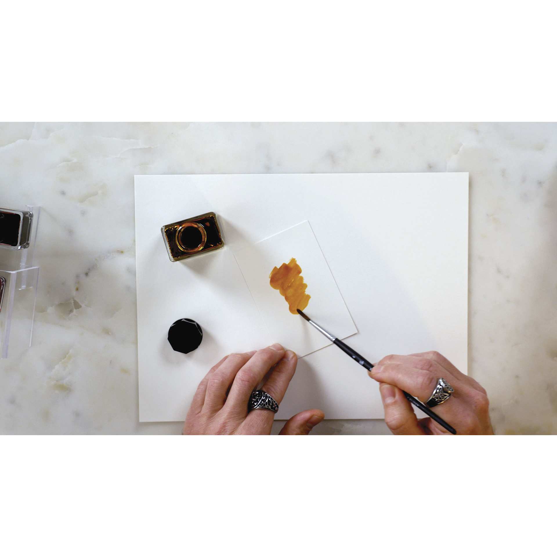 Kuretake Ink-Café Art Nouveau Inks, brush in hand painting a color swatch