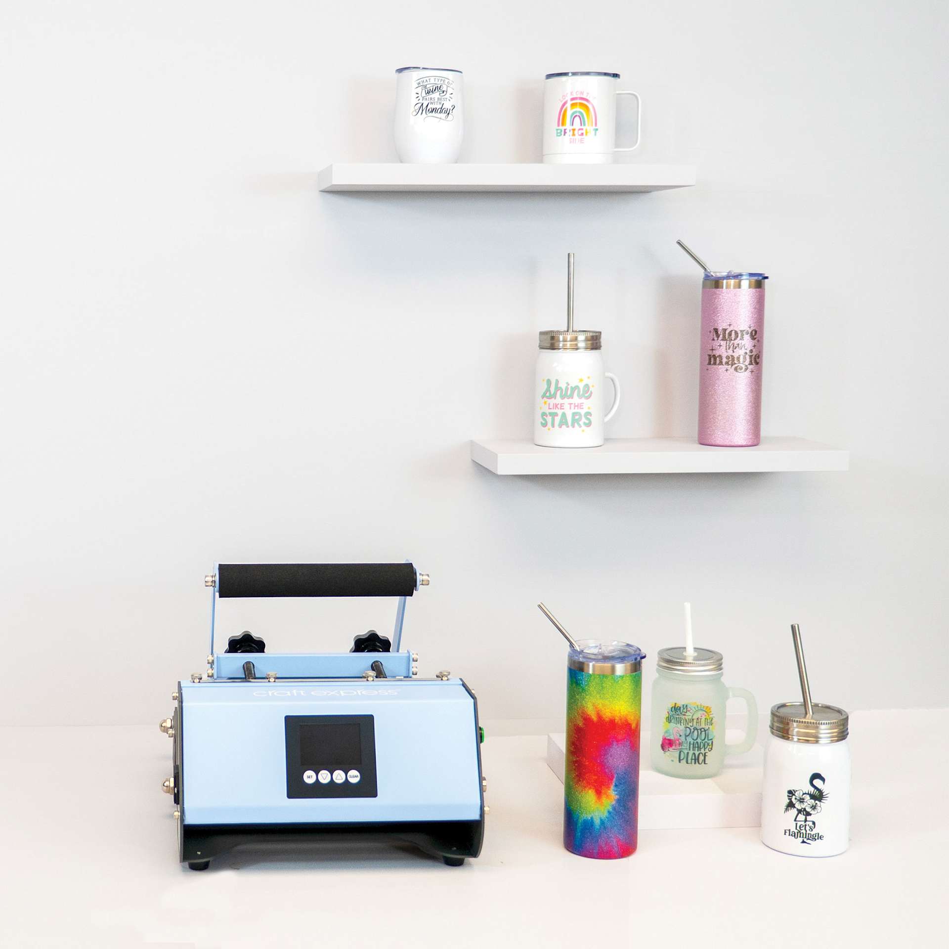 Craft Express Sublimation Elite Pro Tumbler Heat Press (on desk with finished drinkware examples)