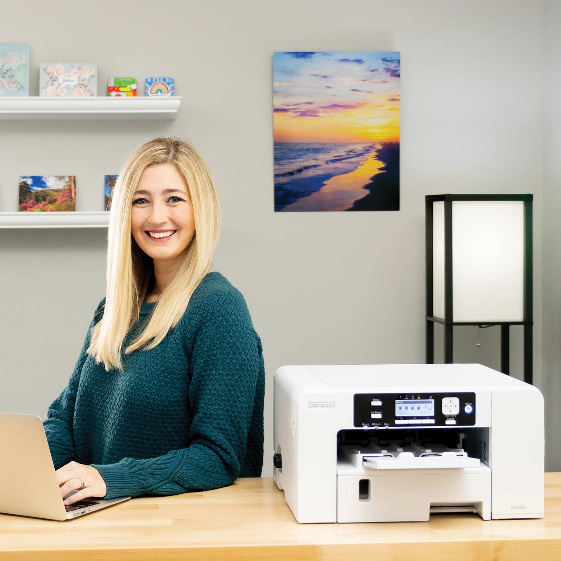 Sawgrass Sublimation Printer - SG500 (person using laptop to send design to printer)