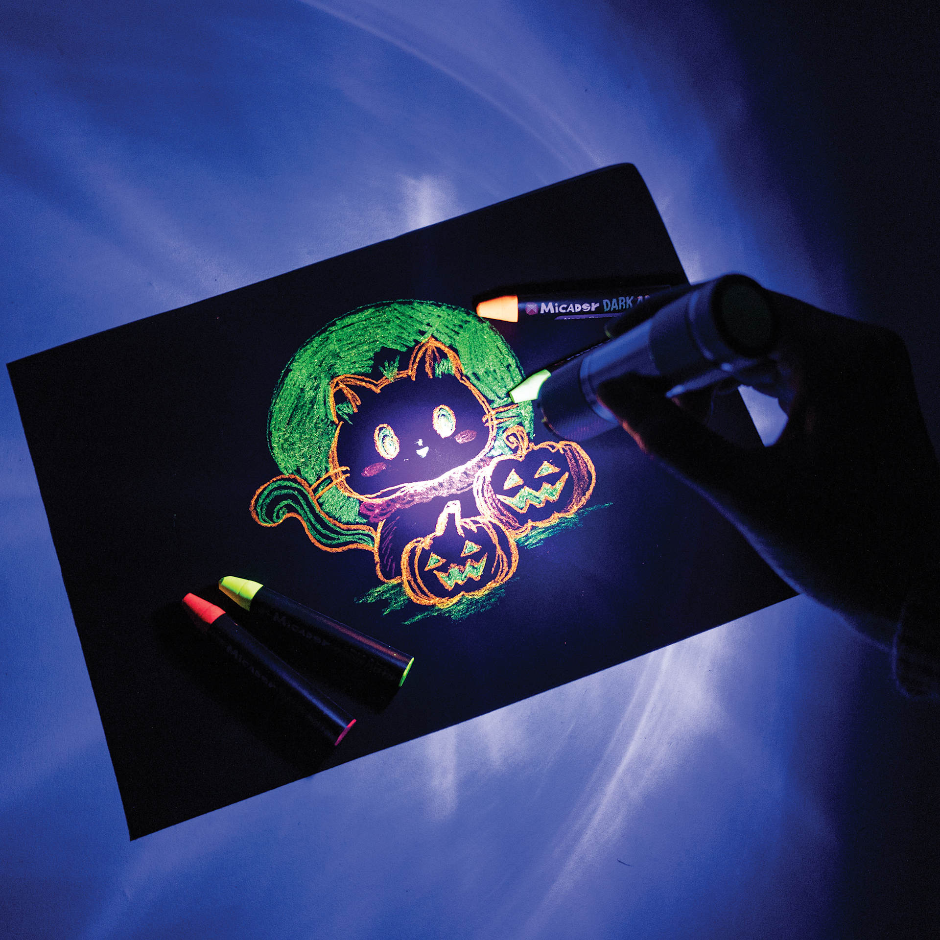 Micador Dark Arts Magic Black Light shining on a drawing that used fluorescent mediums.
