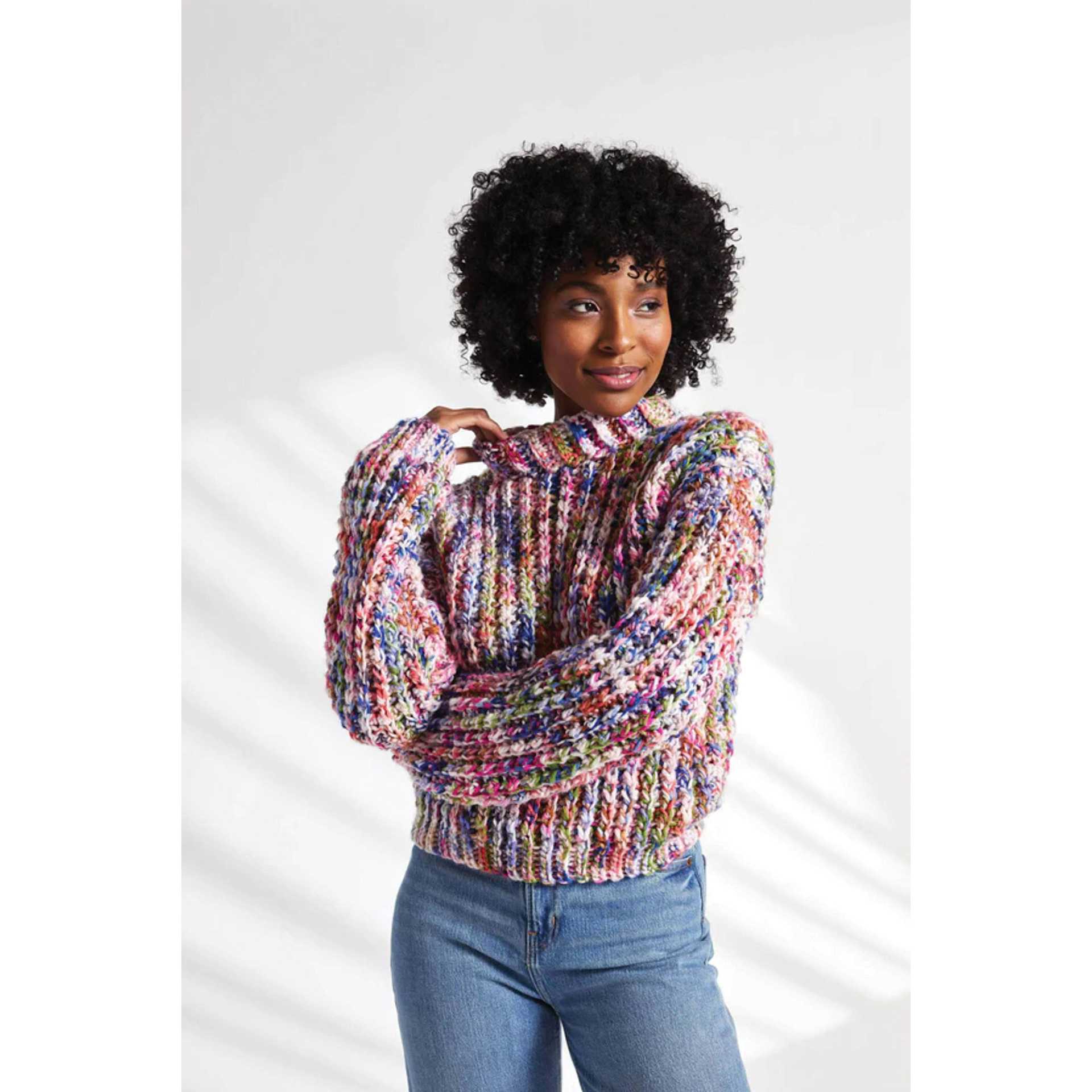 Premier Yarn Serenity Chunky Candy Yarn, adult wearing sweater made of multicolored yarn
