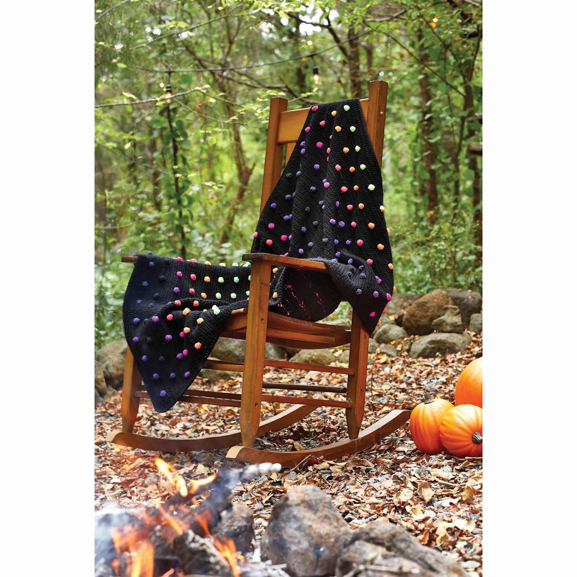 Premier Yarn Sweet Roll Vivid, throw blanket on top of wooden chair