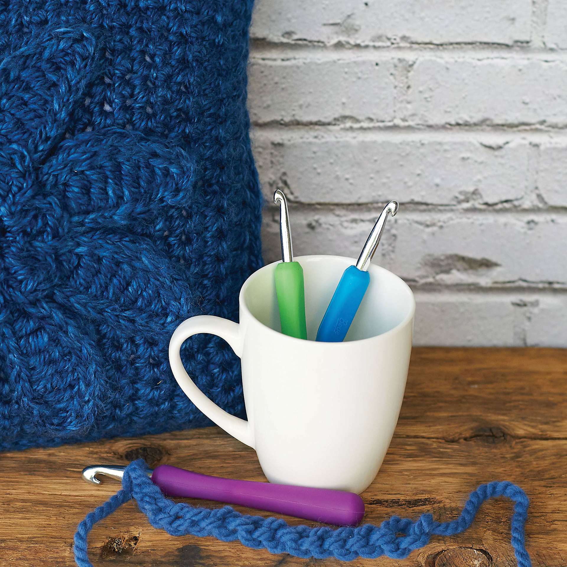 Boye Ergo Crochet Hooks - J, K, and purple N hook in use on desk