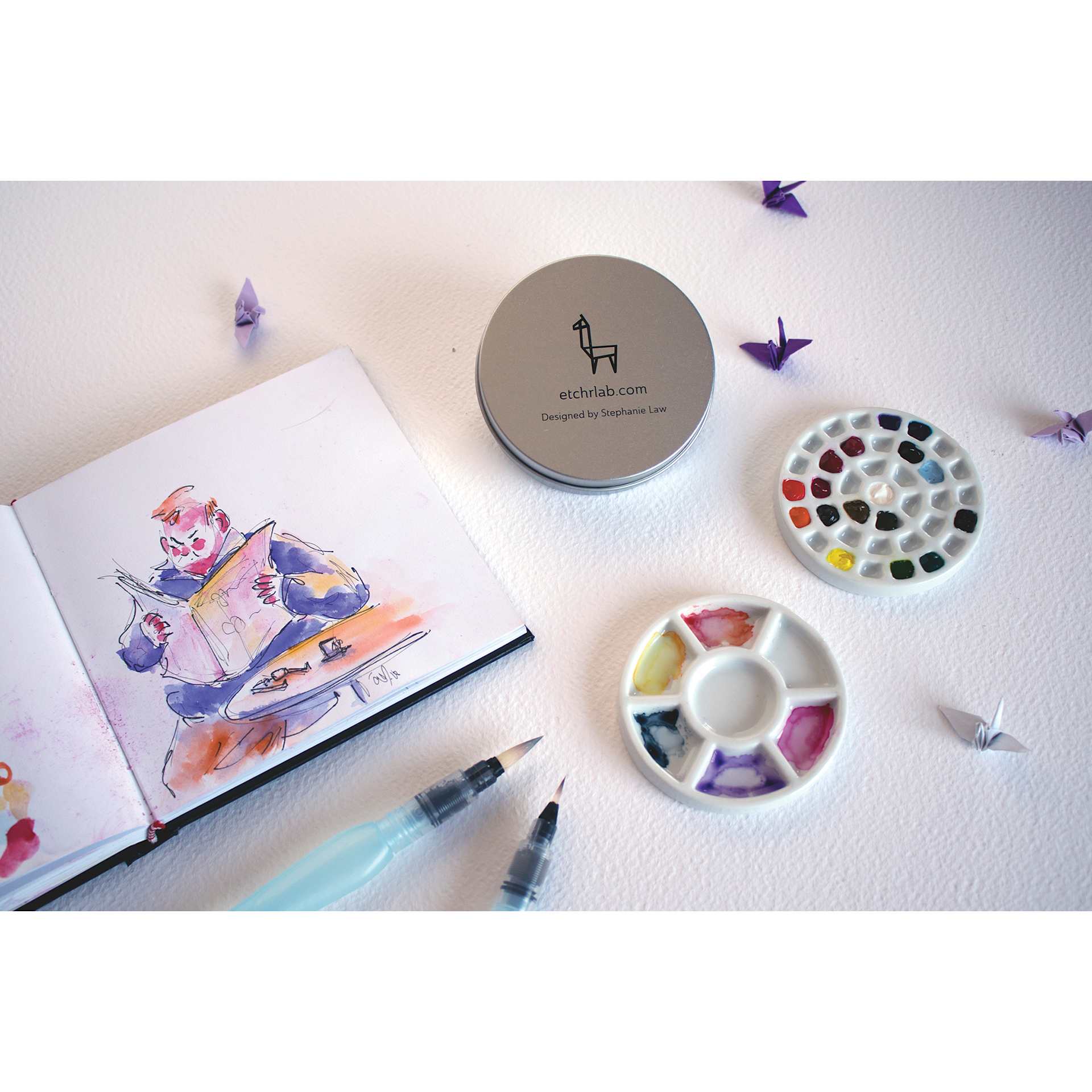 Etchr Lab Travel Mini Porcelain Palette, 37 Wells, palette on desk with artwork
