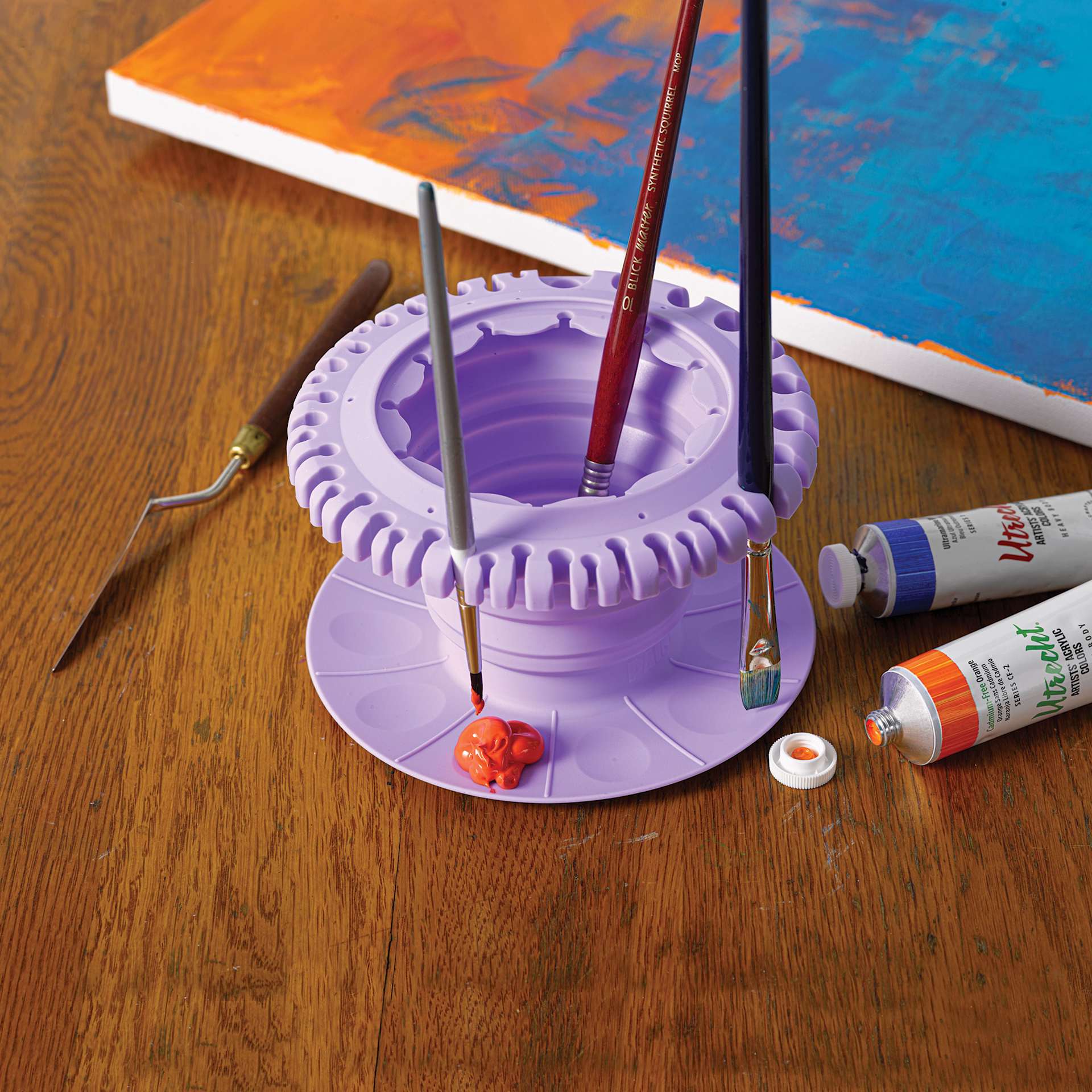 Paint Puck CollapsiBowl Portable Brush Cleaner, tool in use (brushes and paints not included)