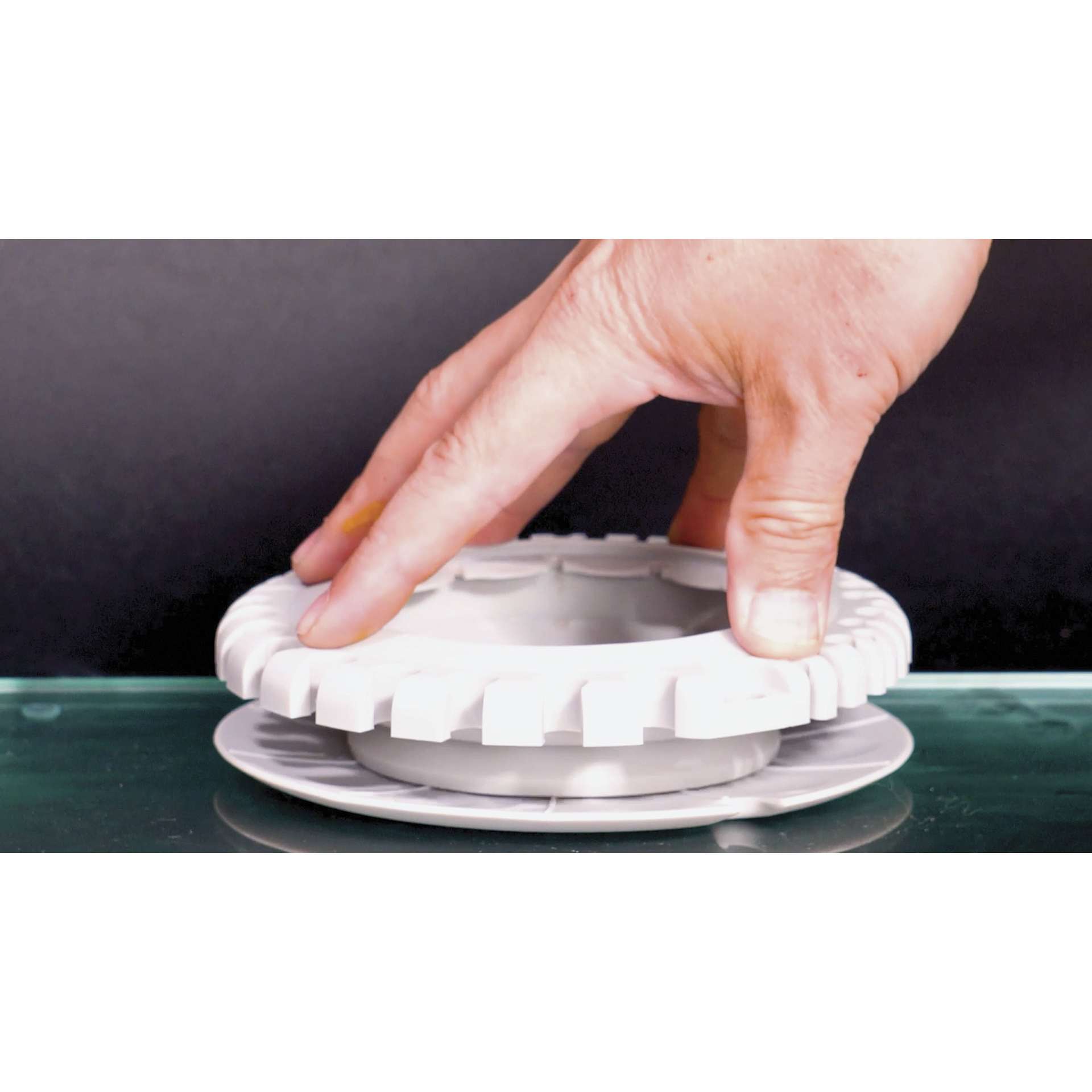 Paint Puck CollapsiBowl Portable Brush Cleaner, being collapsed