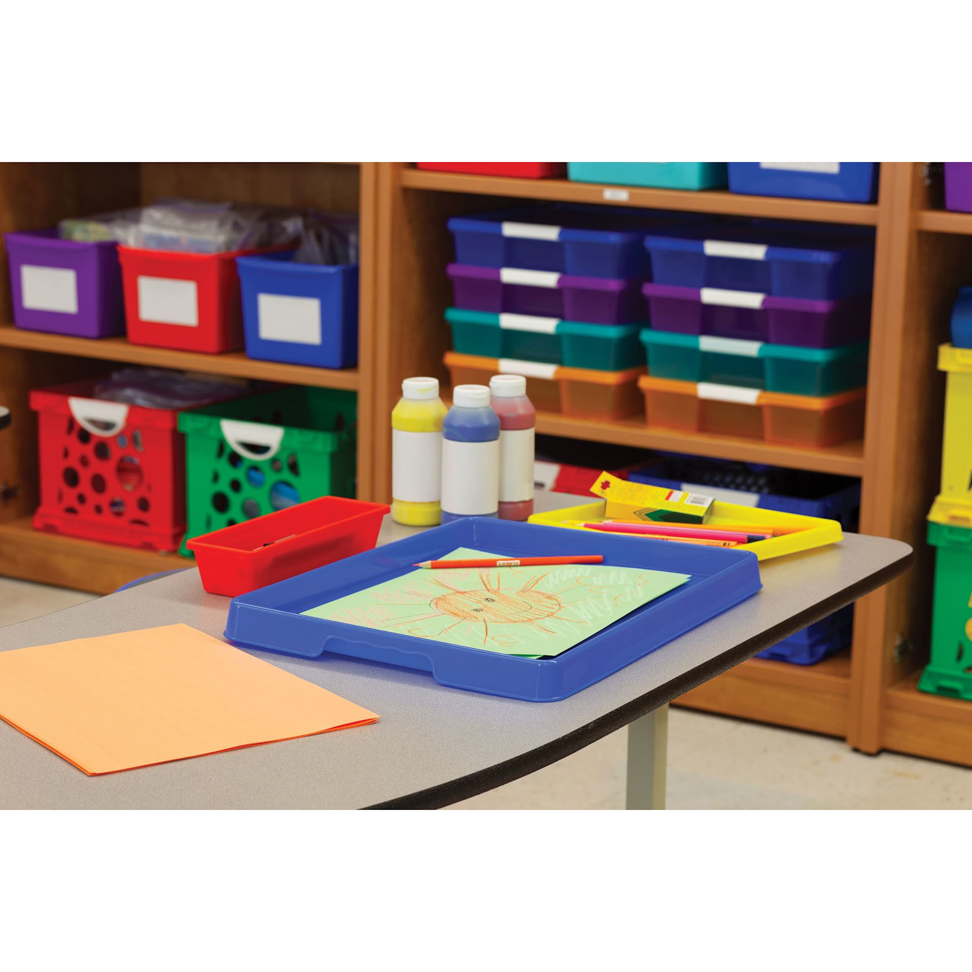 Storex Activity Trays - Assorted Colors, Set of 12, blue tray on table in classroom
