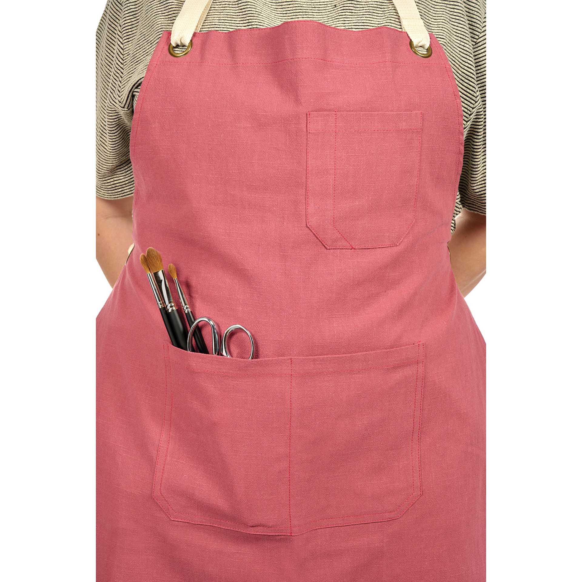 Blick Artisan Apron - Brick Red on a person (brushes and scissors not included)