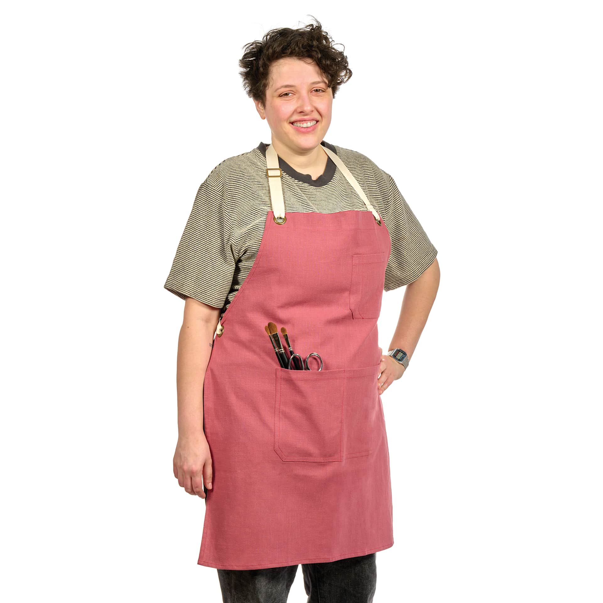 Front view of Blick Artisan Apron - Brick Red on a person